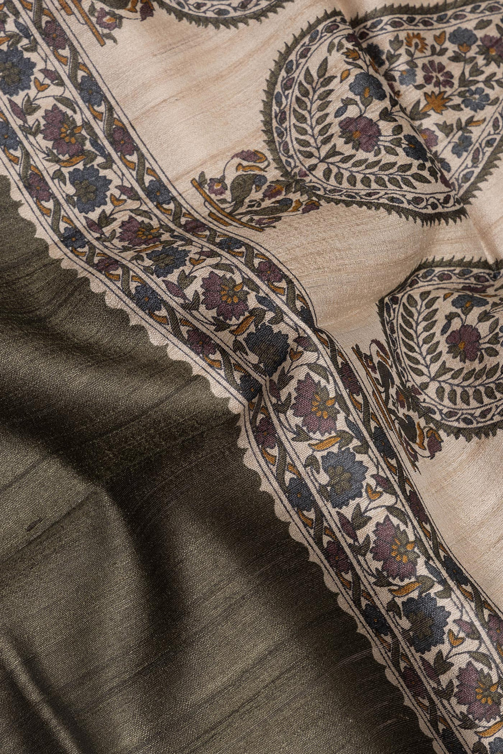Close up of Pure Silk Mehandi Green Tussar Saree with Zari Butta on the body and Zari Border.  displaying folds