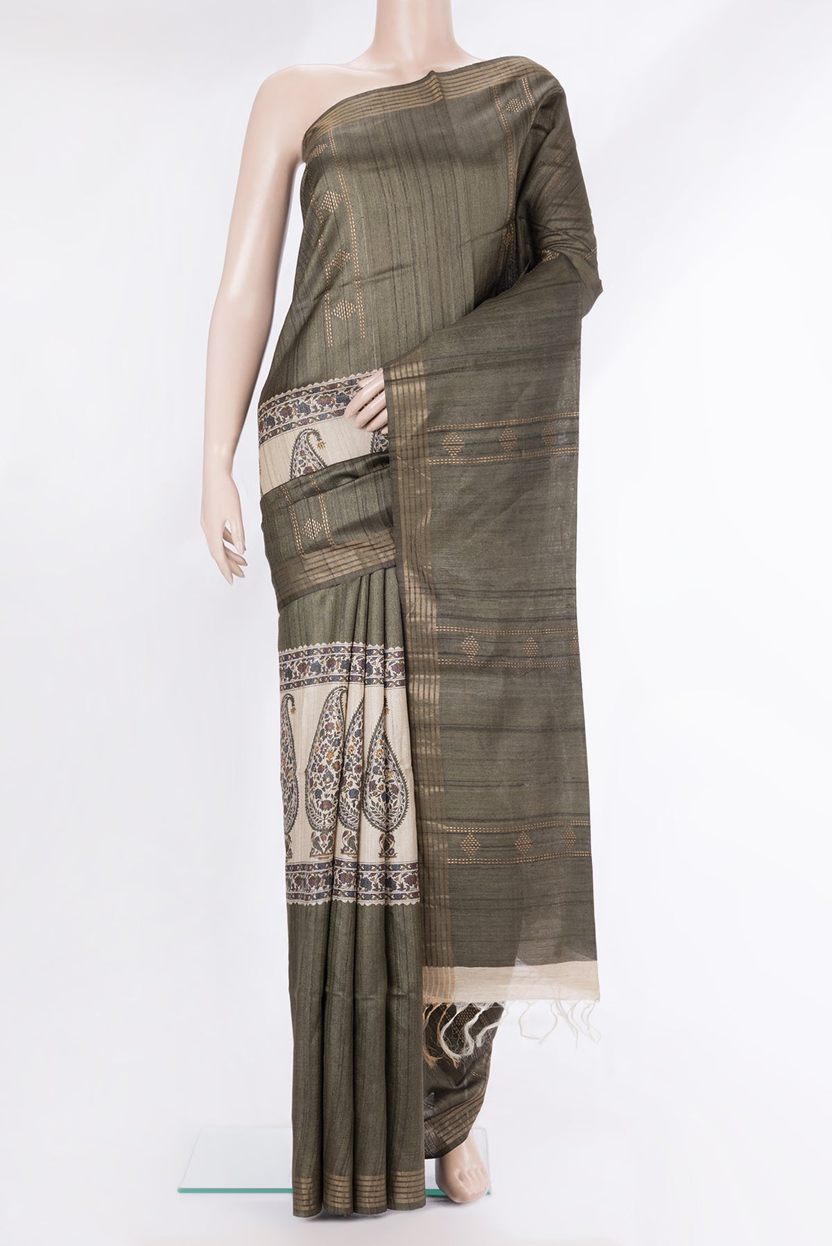 Pure Silk Mehandi Green Tussar Saree with Zari Butta on the body and Zari Border.  displayed on a mannequin