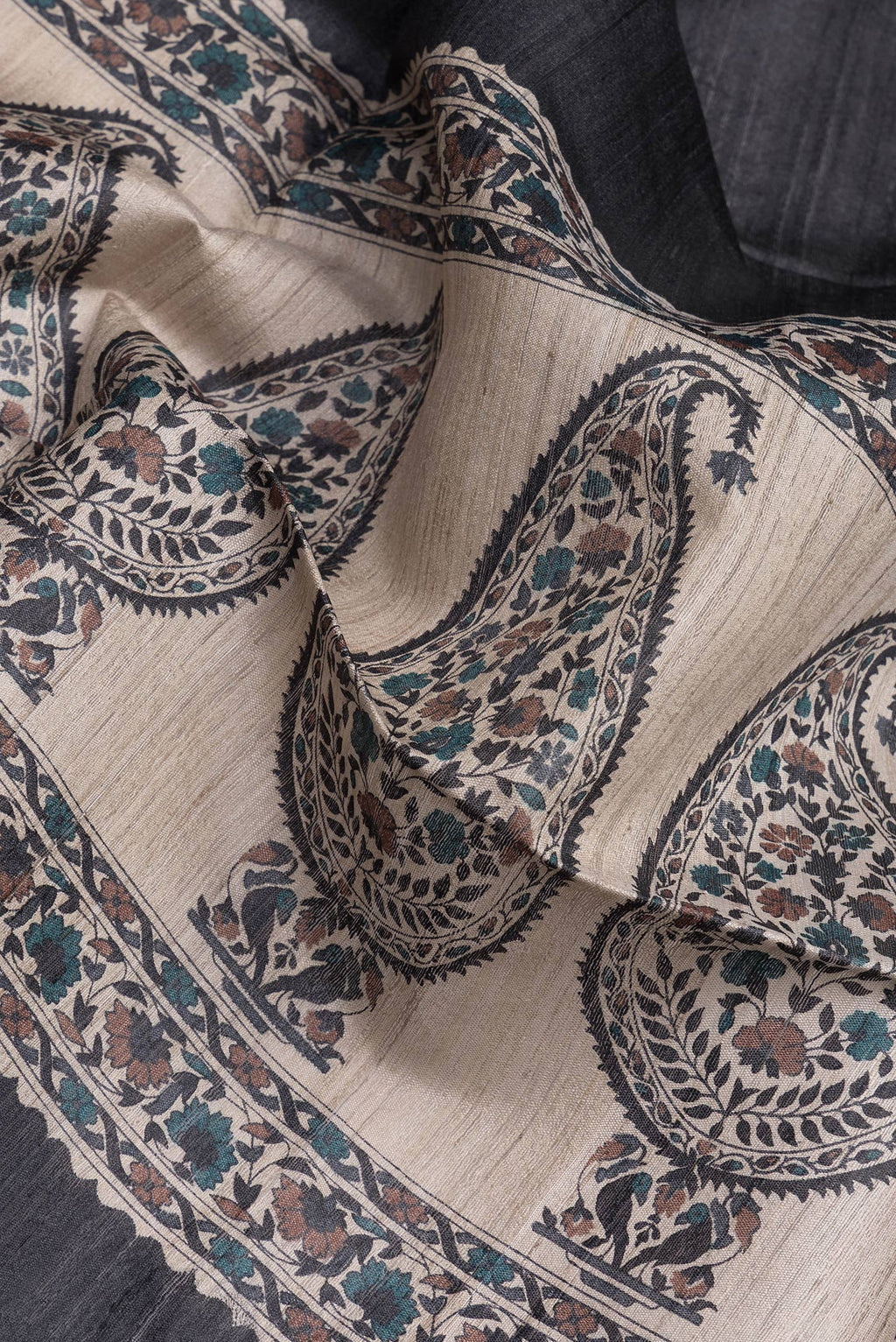 Close up of Black Tussar Silk Saree with Stripes on the body and Zari Border.  displaying folds