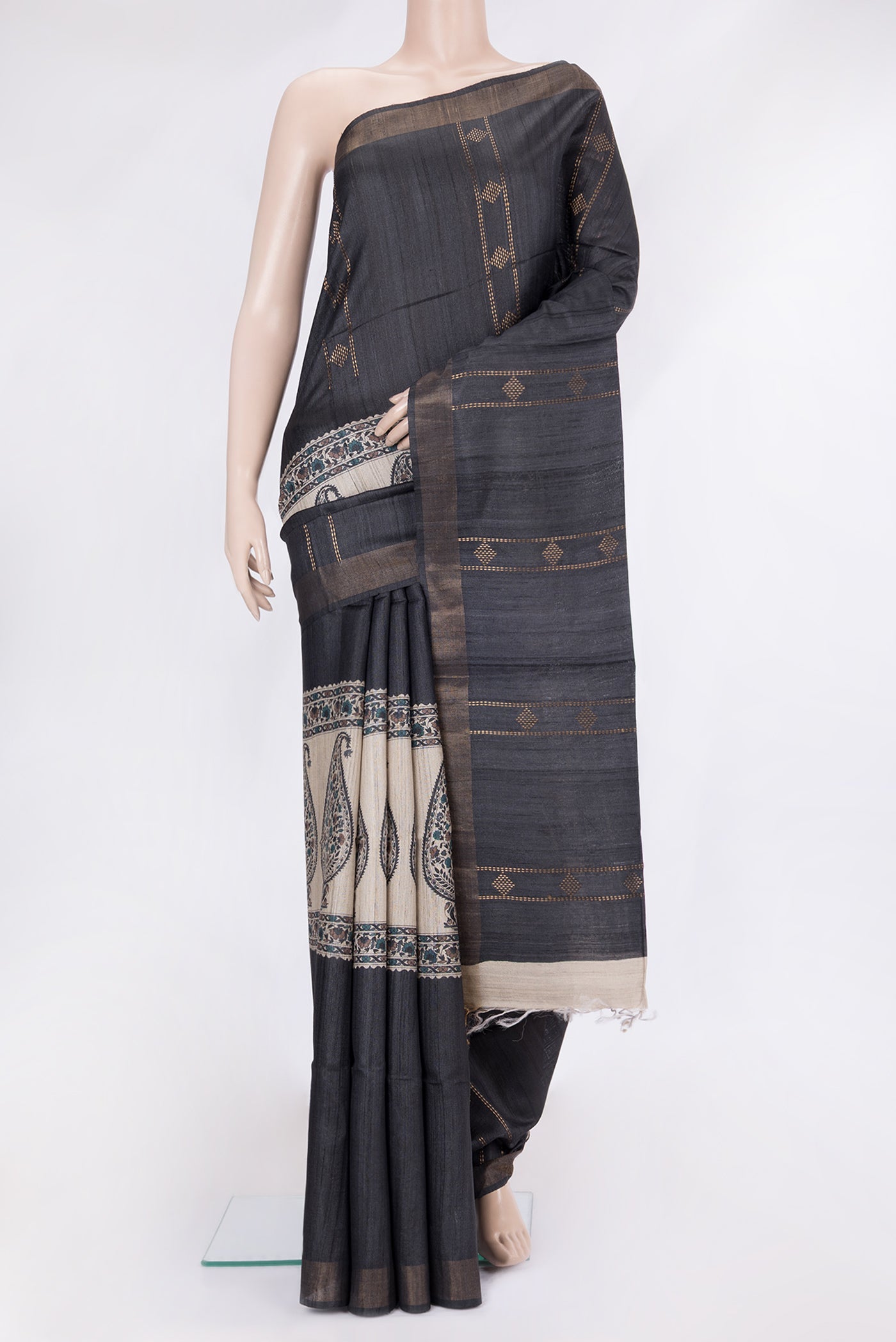 Black Tussar Silk Saree with Stripes on the body and Zari Border.  displayed on a mannequin