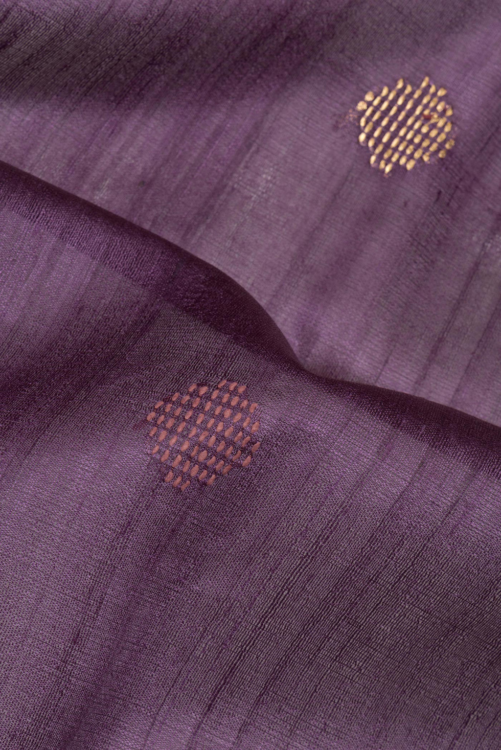 Close up of Purple Tussar Saree with Thread Butta on the body and Zari Border.  displaying folds