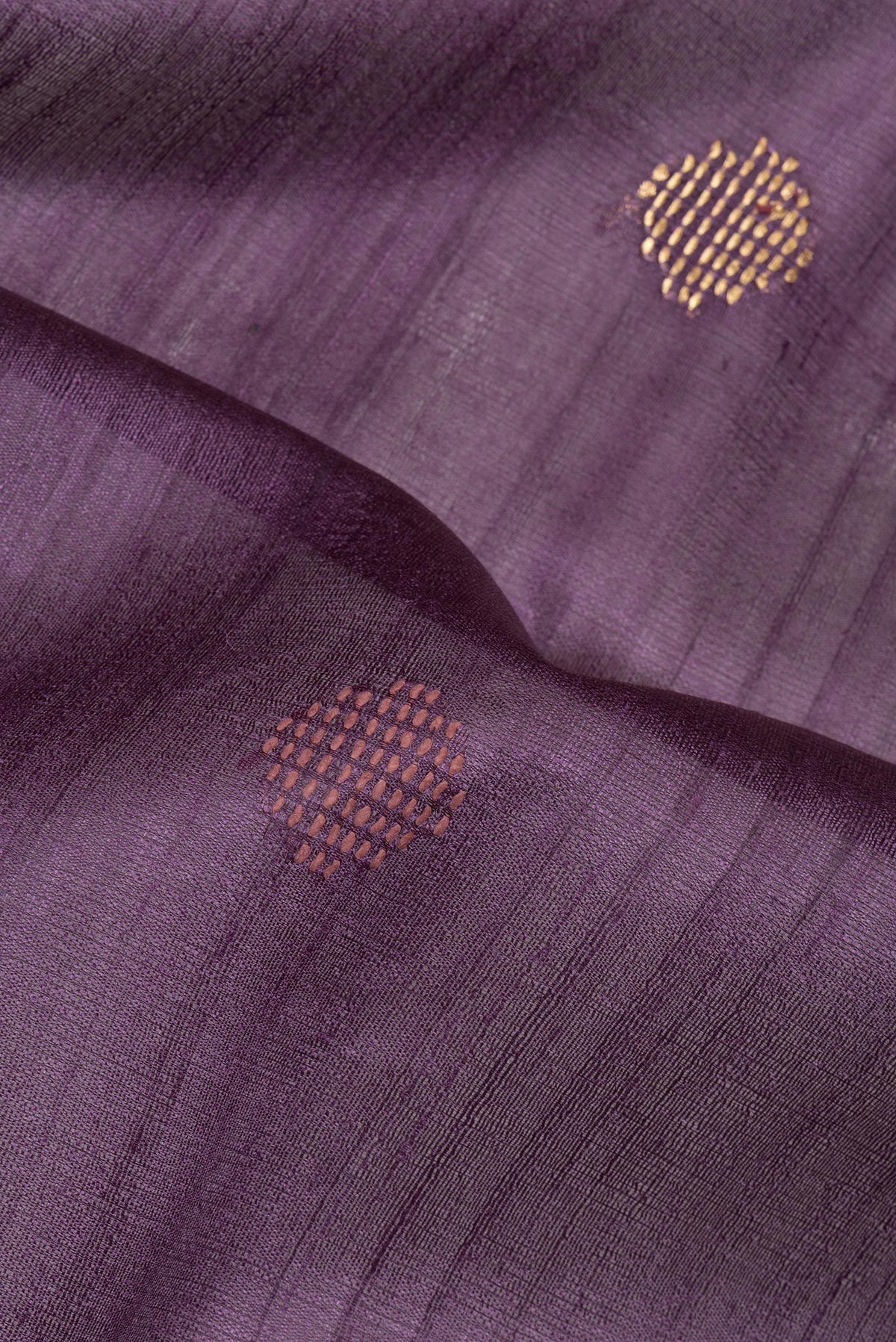 Close up of Purple Tussar Saree with Thread Butta on the body and Zari Border.  displaying folds