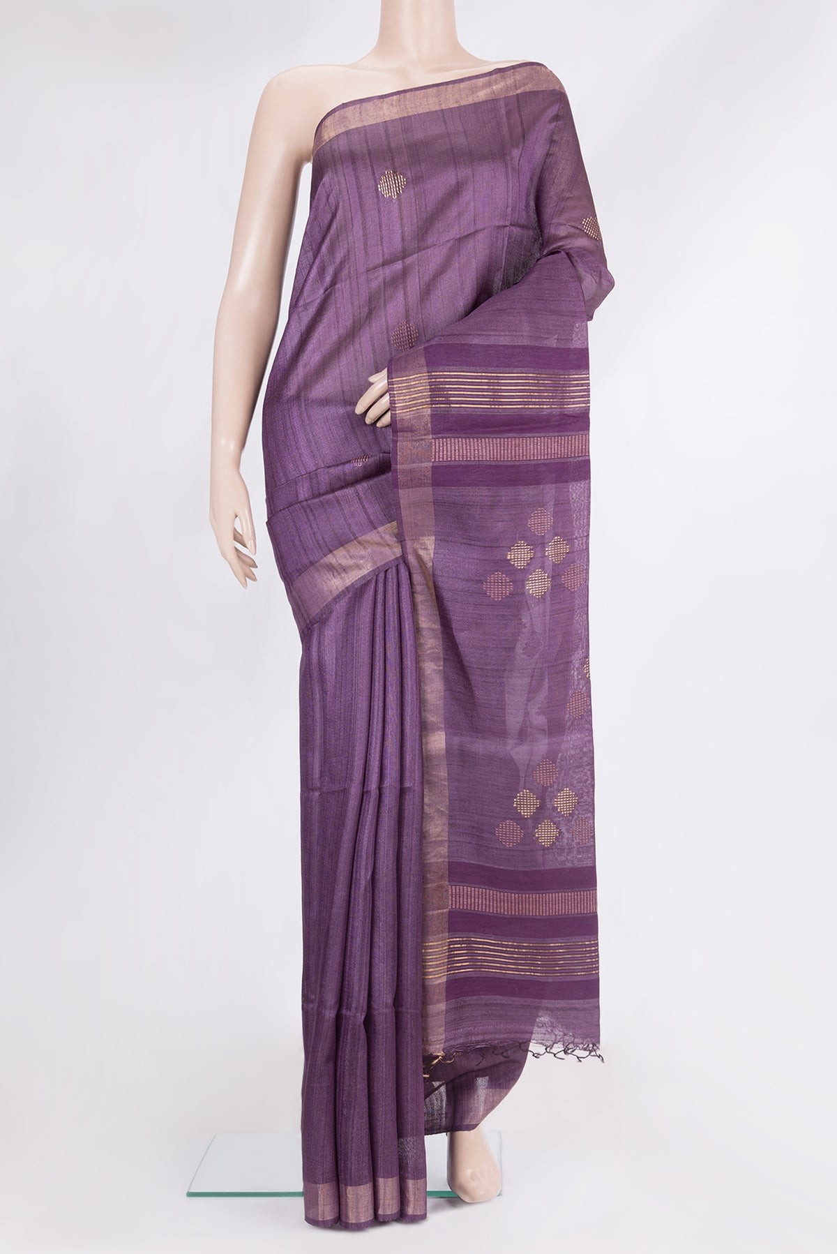 Purple Tussar Saree with Thread Butta on the body and Zari Border.  displayed on a mannequin