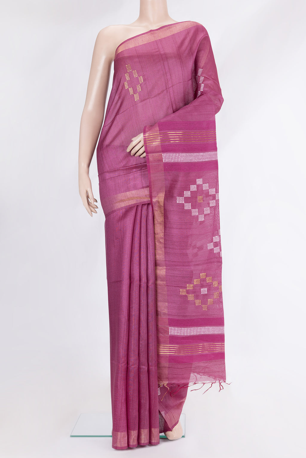 Pink Tussar Silk Saree with Thread Butta on the body and Zari Border.  displayed on a mannequin