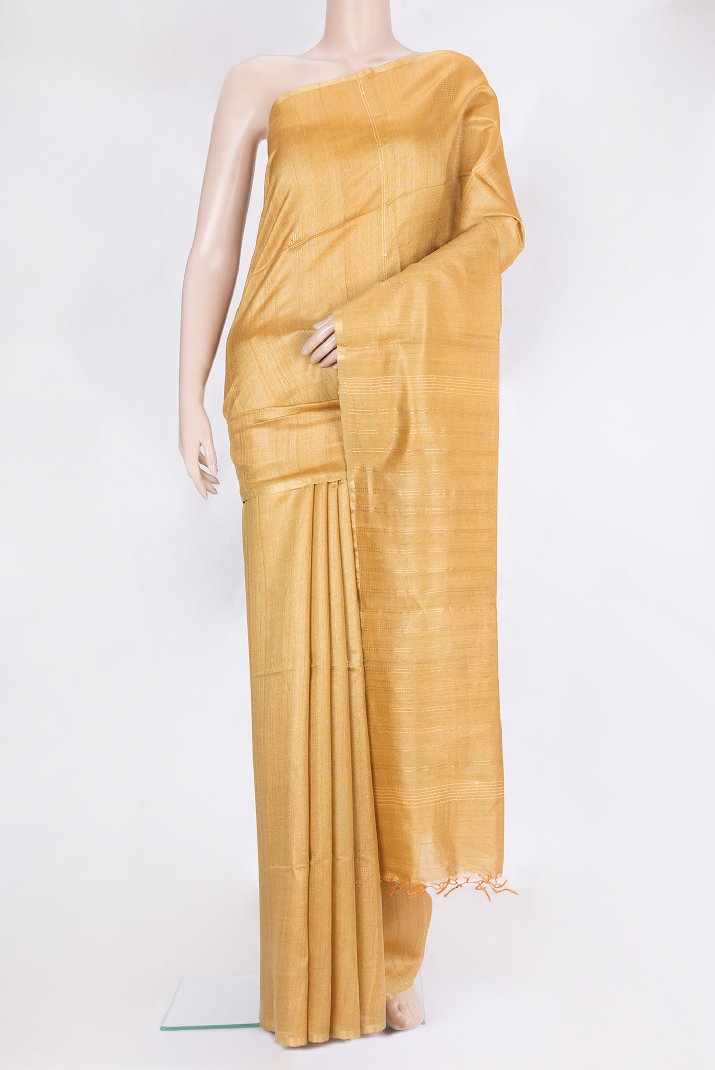 Sandal Tussar Silk Saree with Plain Body and Zari Border.  displayed on a mannequin