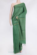 Green Tussar Silk Saree with Embroidery on the body and Zari Border.  displayed on a mannequin