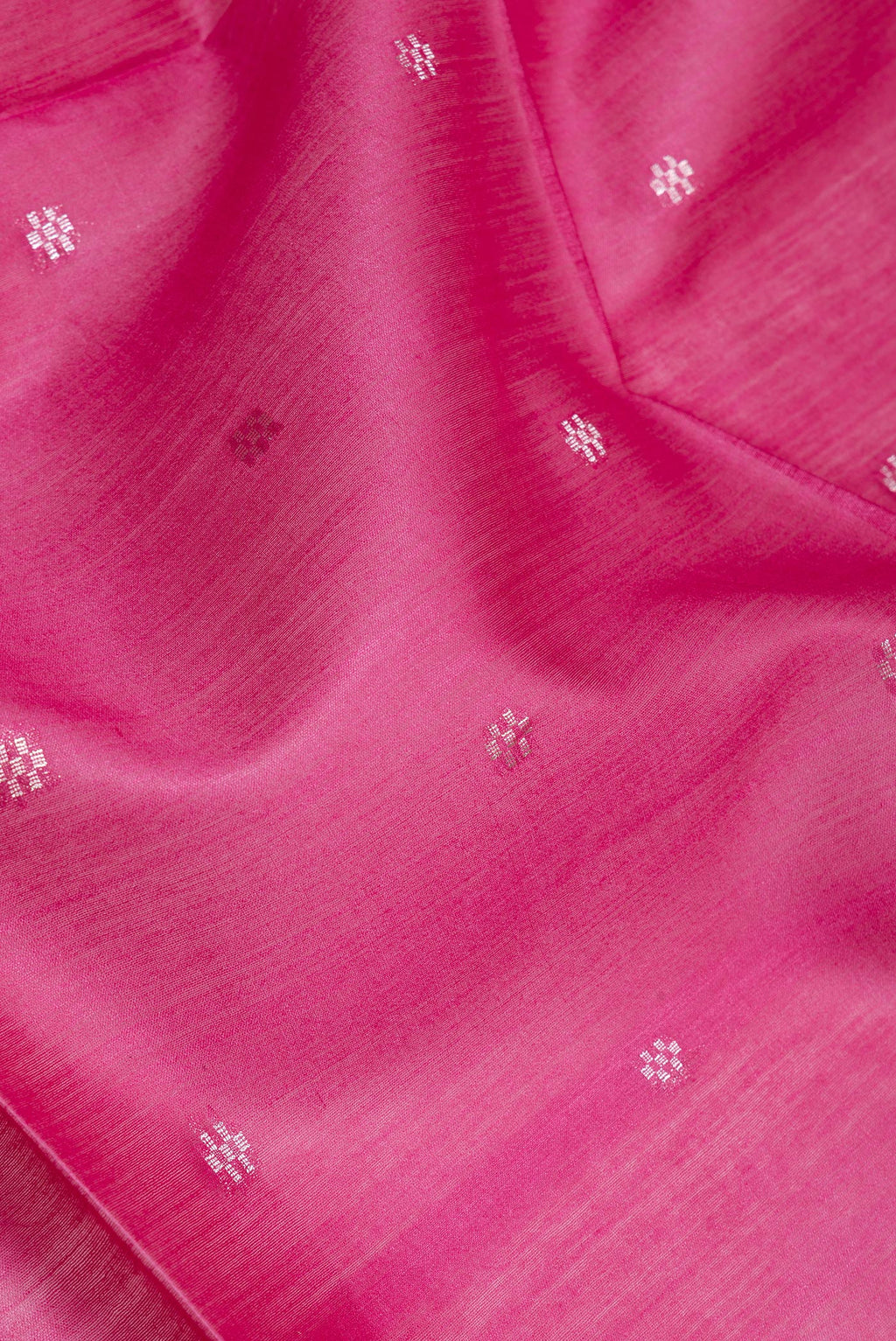 Close up of Pink Dual Tone Tussar Silk Saree with Zari Butta on the body and Zari Border.  displaying folds