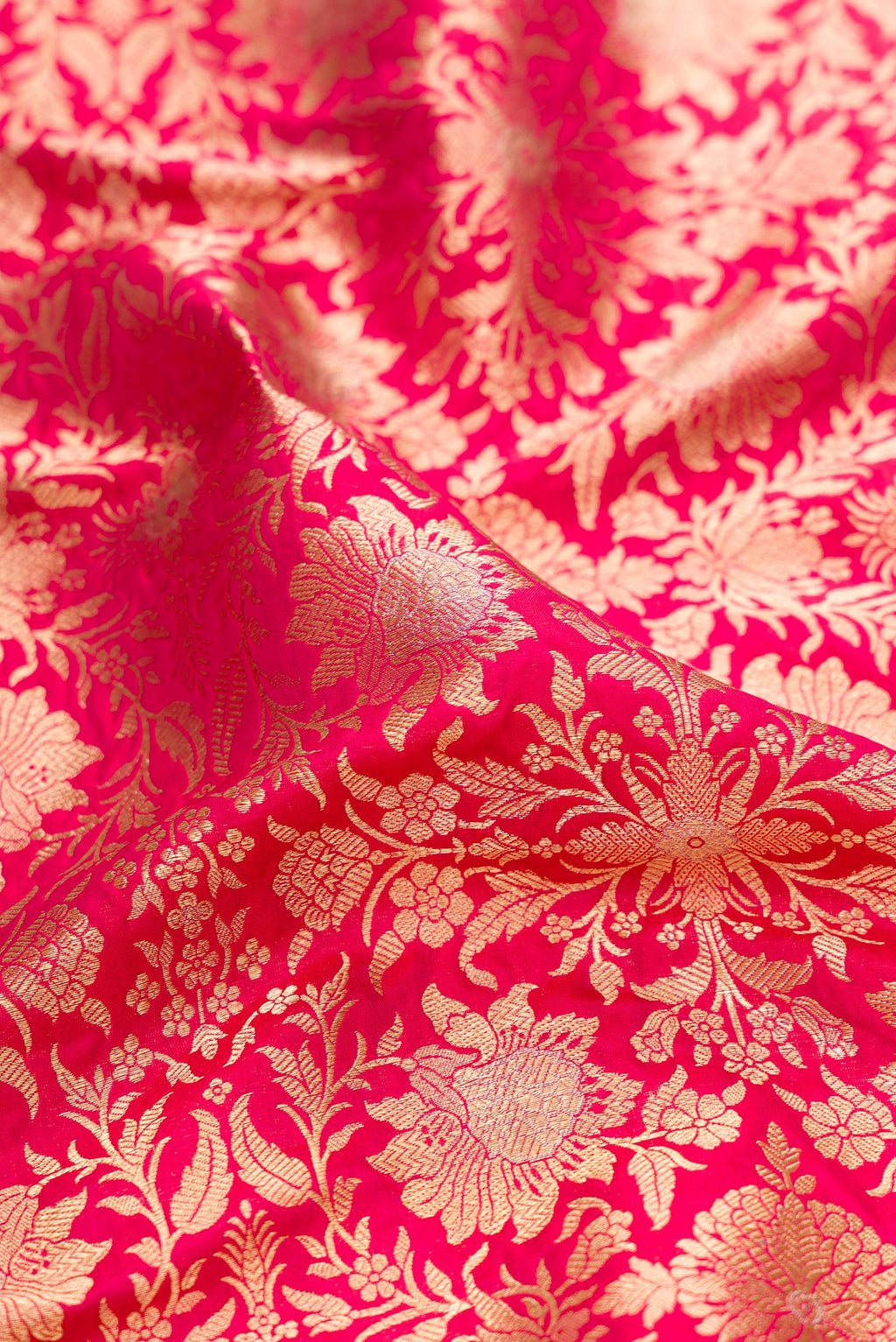 Close up of Dark Pink Dual Tone Banarasi Silk Saree with Zari Brocade on the body and Zari Border.  displaying folds
