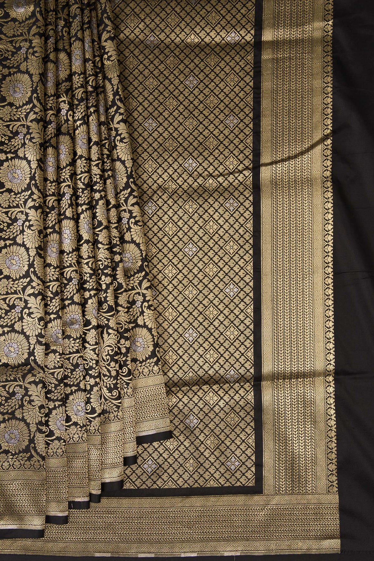 Pleats and pallu of Black Banarasi Silk Saree with Zari Brocade on the body and Zari Border. 