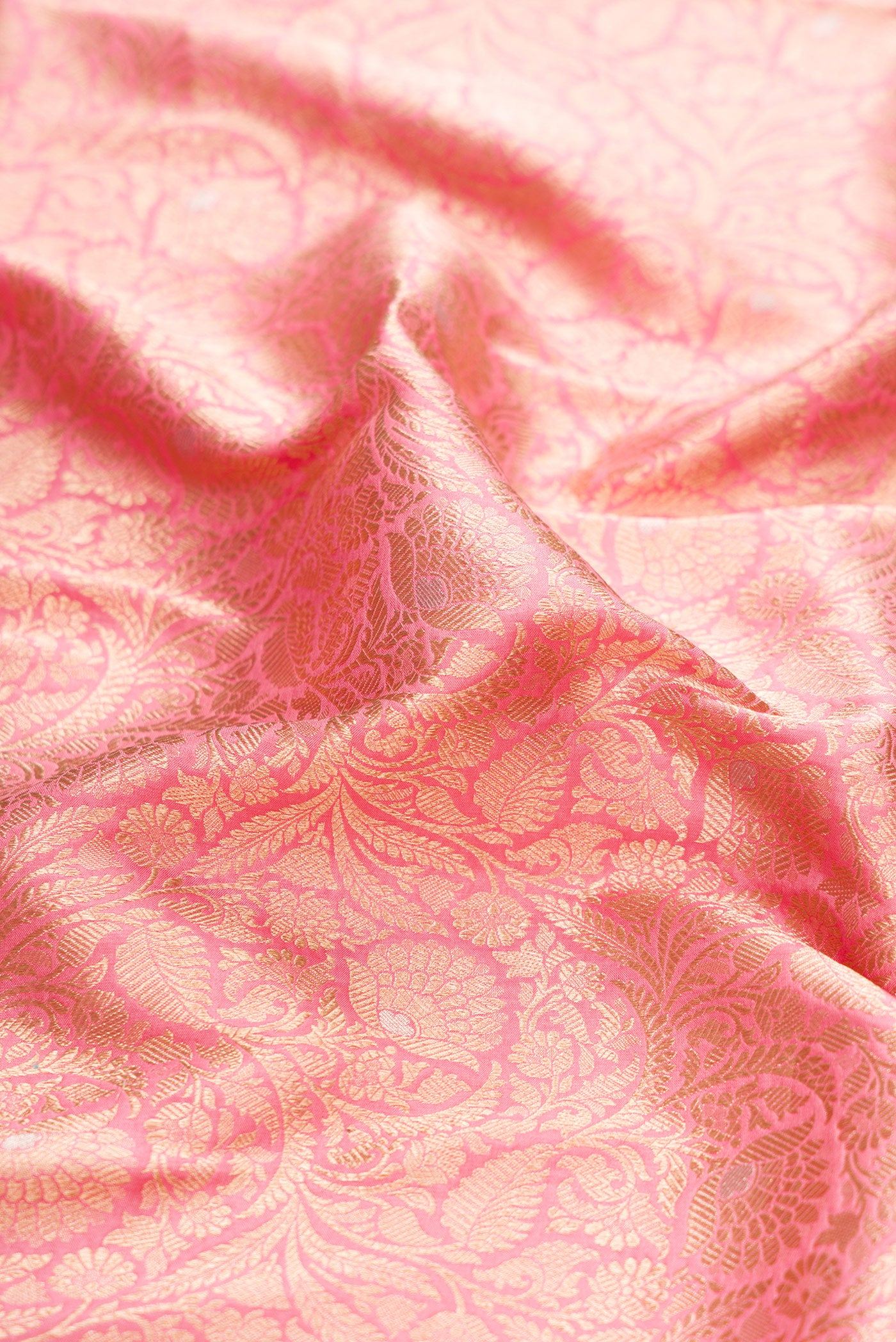 Close up of Pink Banarasi Silk Saree with Zari Brocade on the body and Zari Border.  displaying folds