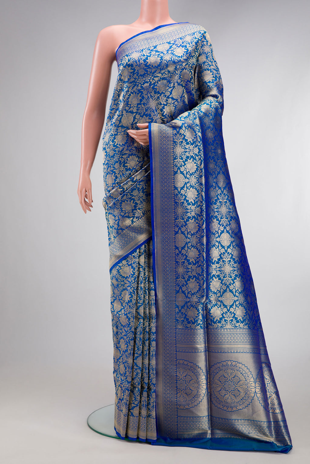 Peacock Blue Banarasi Silk Saree with Zari Brocade on the body and Zari Border.  displayed on a mannequin