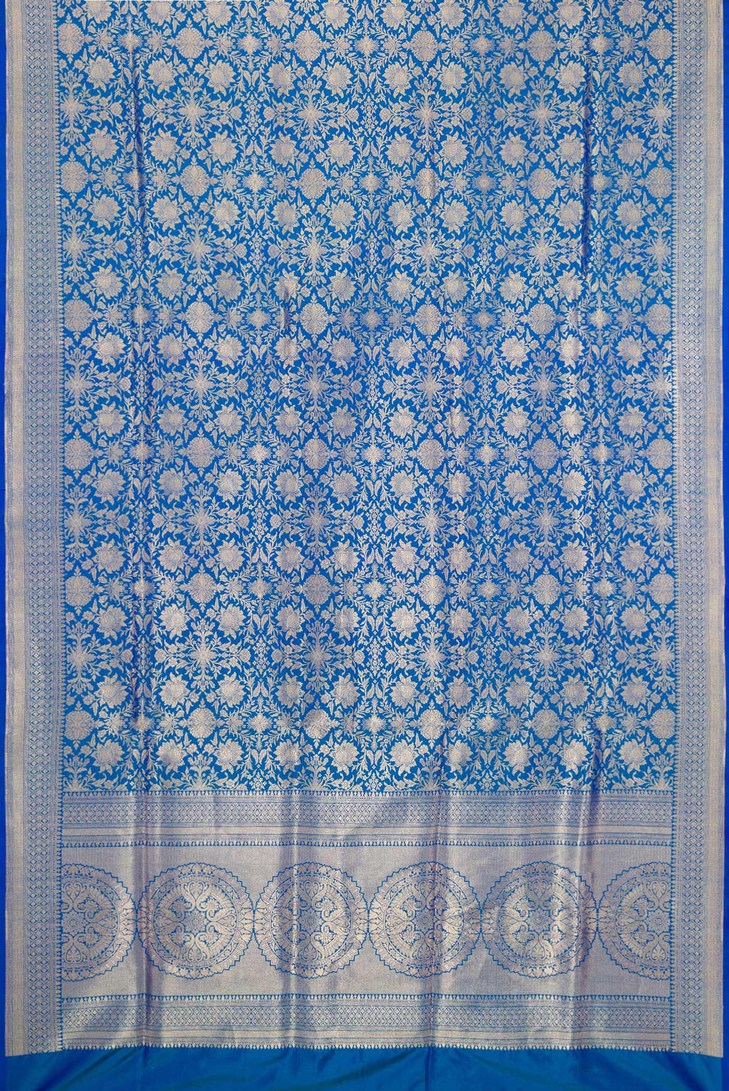 Flat view of Peacock Blue Banarasi Silk Saree with Zari Brocade on the body and Zari Border. 