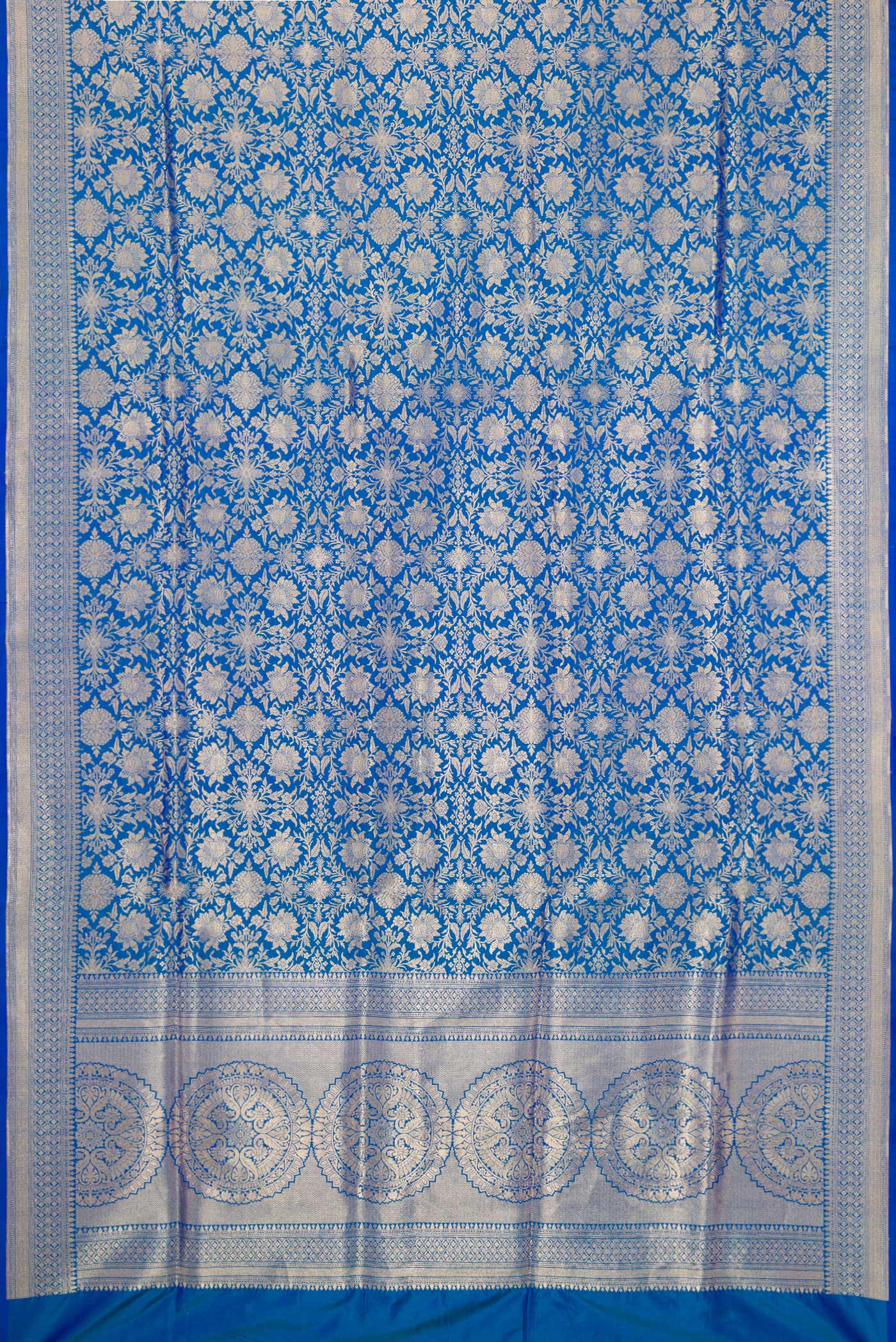 Flat view of Peacock Blue Banarasi Silk Saree with Zari Brocade on the body and Zari Border. 