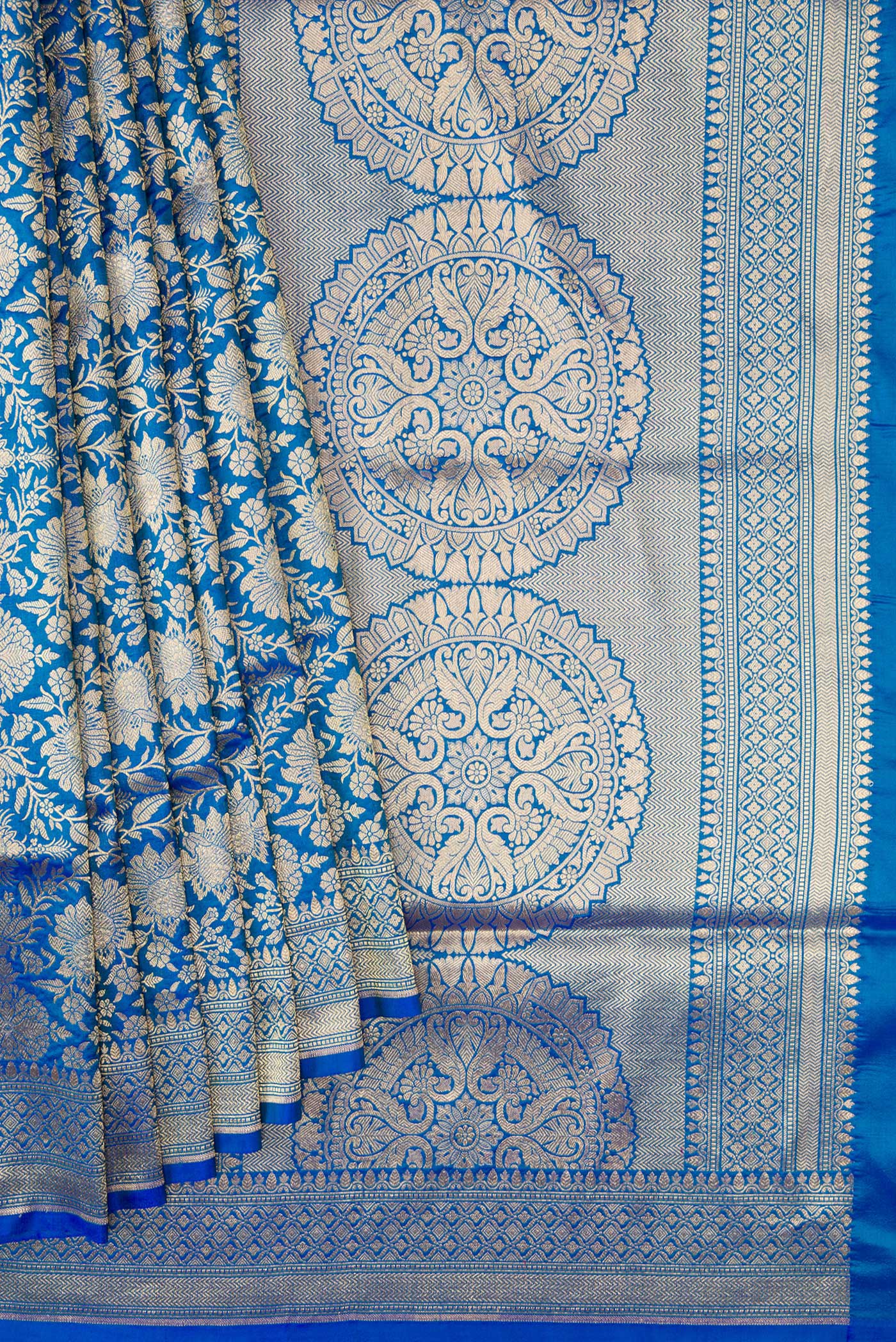 Pleats and pallu of Peacock Blue Banarasi Silk Saree with Zari Brocade on the body and Zari Border. 