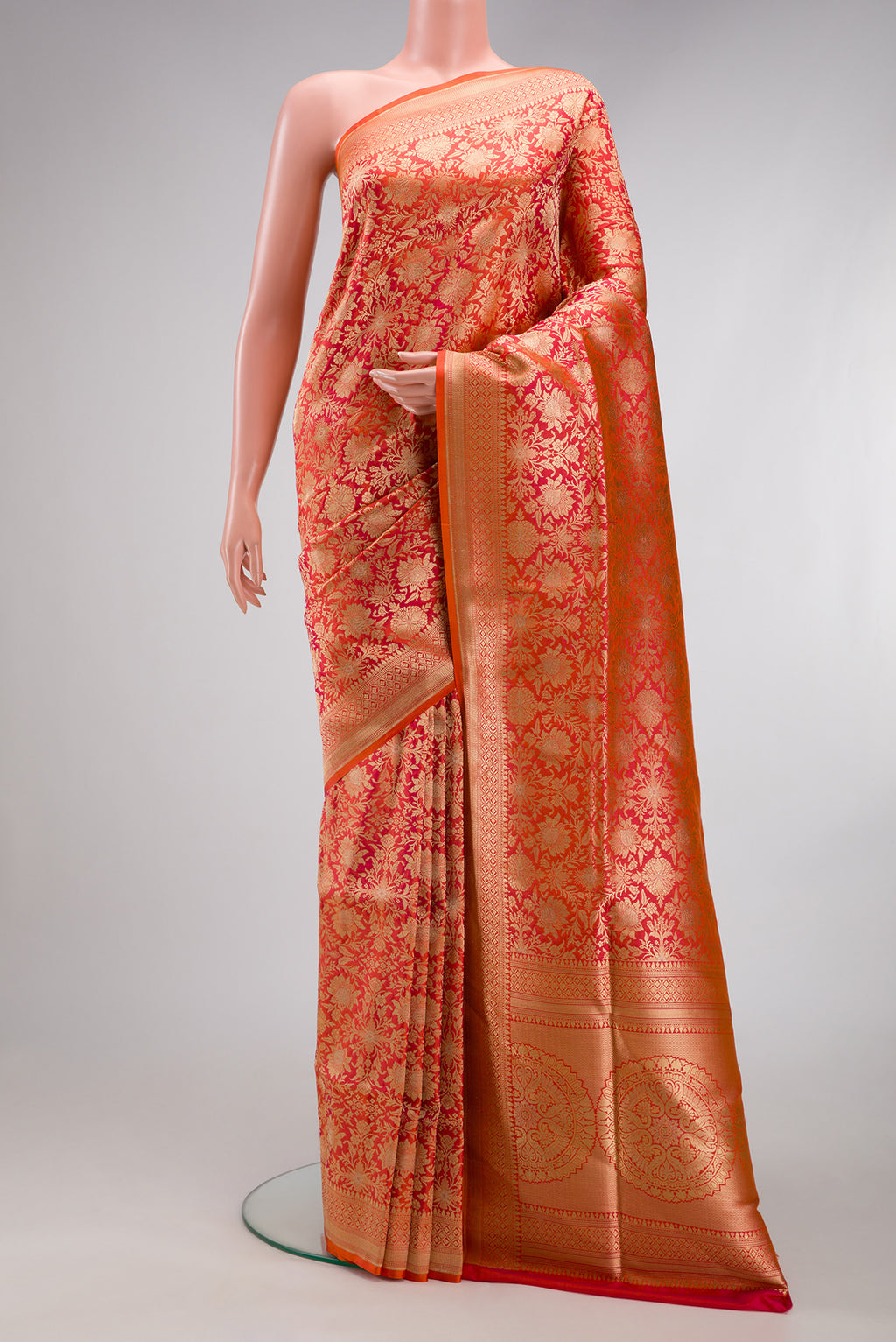 Orange Banarasi Silk Saree with Zari Brocade on the body and Zari Border.  displayed on a mannequin