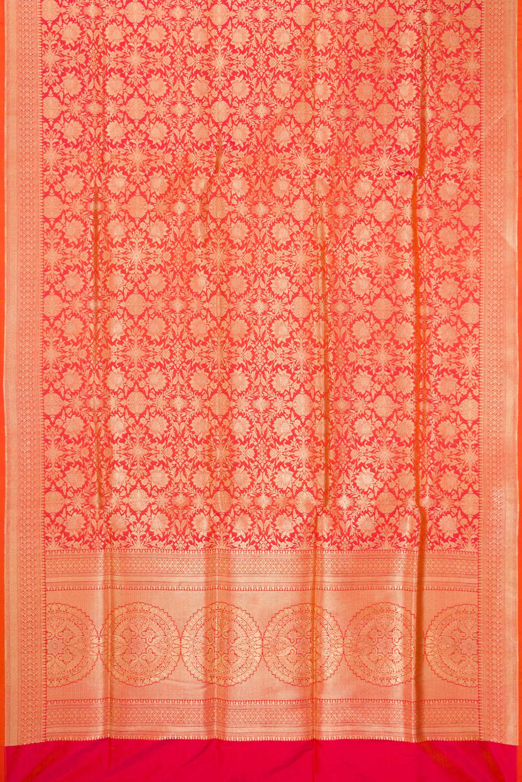 Flat view of Orange Banarasi Silk Saree with Zari Brocade on the body and Zari Border. 