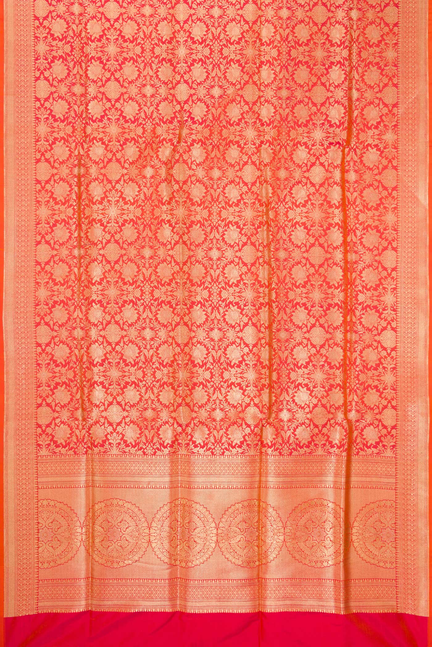 Flat view of Orange Banarasi Silk Saree with Zari Brocade on the body and Zari Border. 