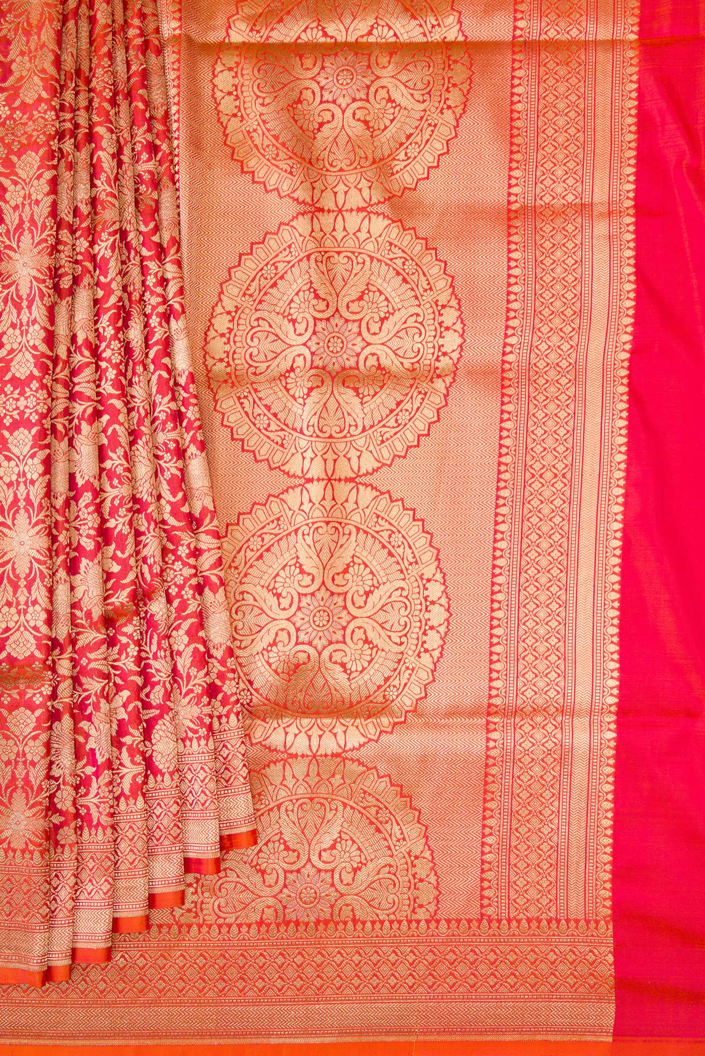 Pleats and pallu of Orange Banarasi Silk Saree with Zari Brocade on the body and Zari Border. 