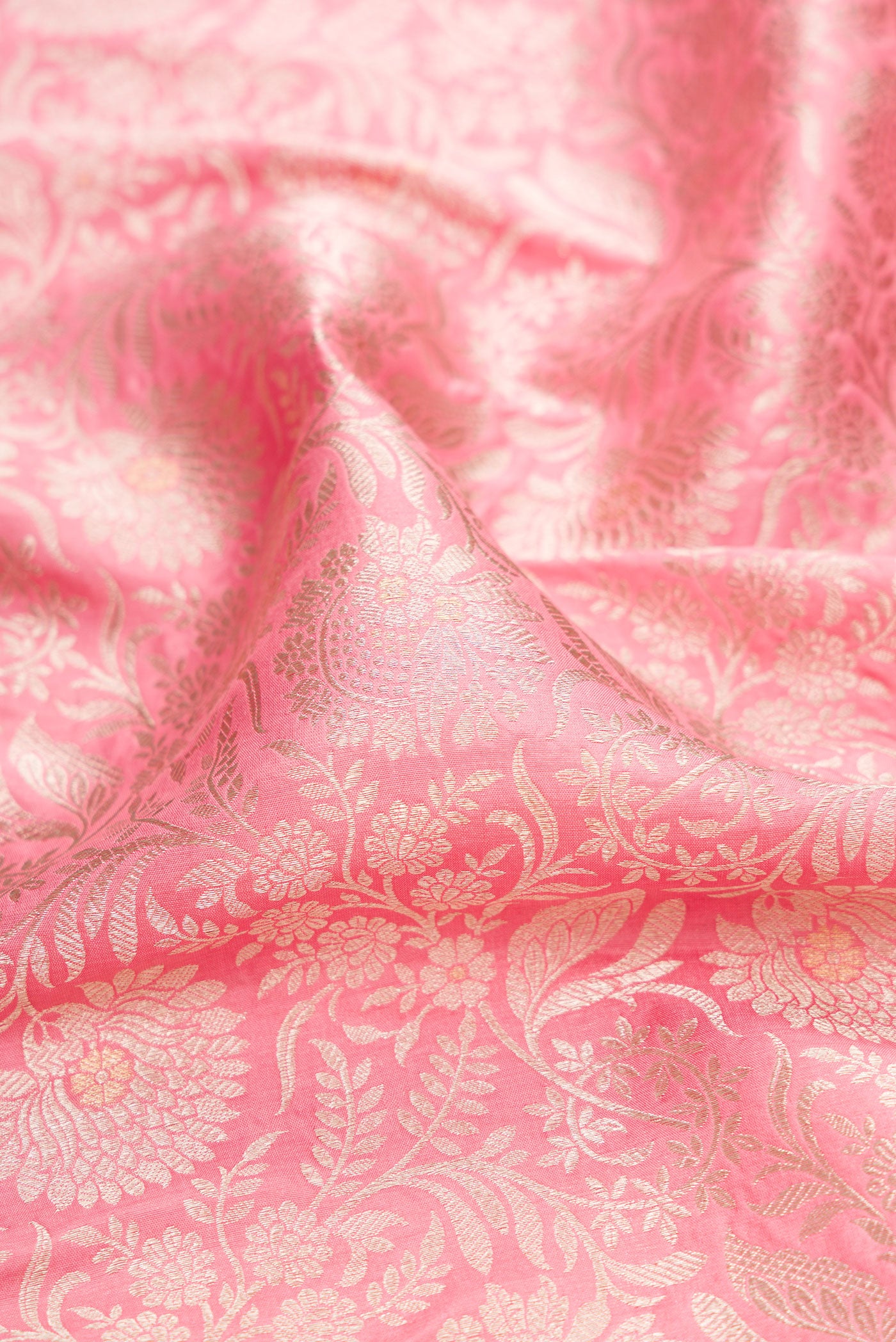 Close up of Pink Banarasi Silk Saree with Zari Brocade on the body and Zari Border.  displaying folds