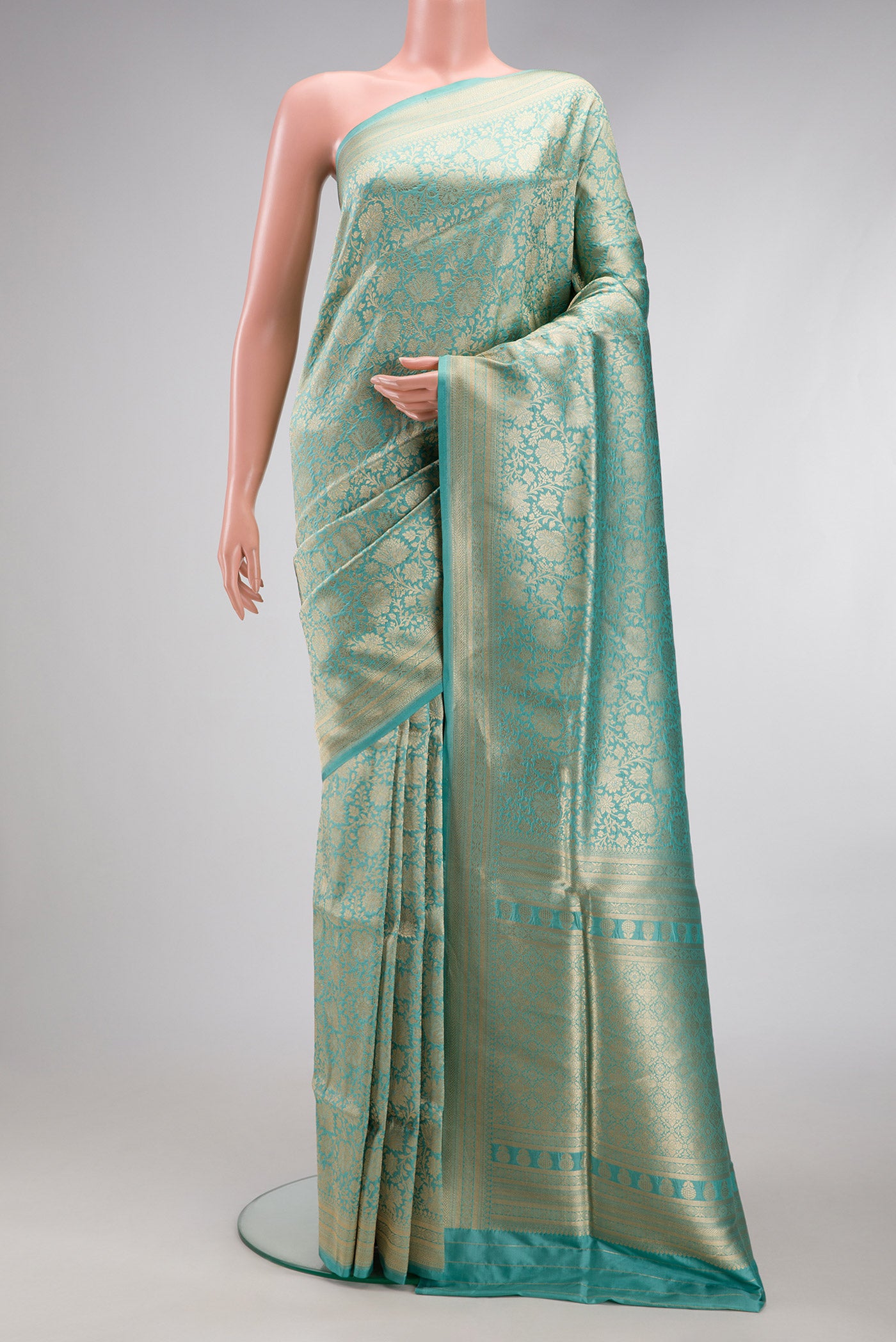 Light Blue Banarasi Silk Saree with Zari Brocade on the body and Zari Border.  displayed on a mannequin
