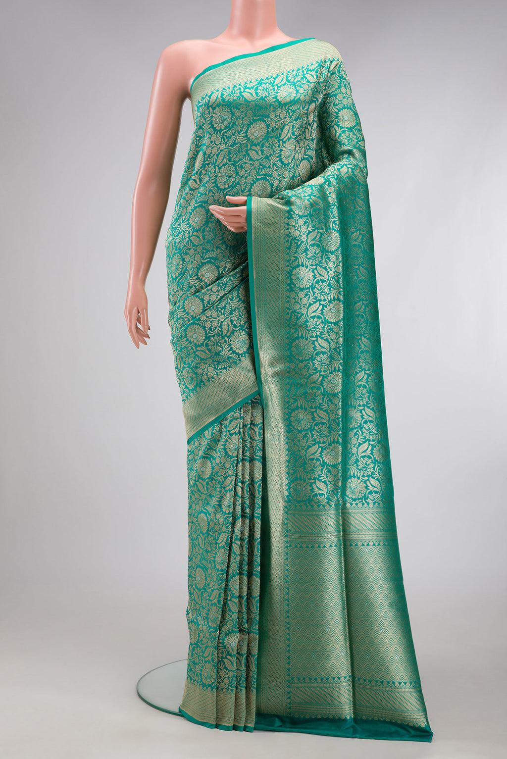 Sea Green Banarasi Silk Saree with Zari Brocade on the body and Zari Border.  displayed on a mannequin