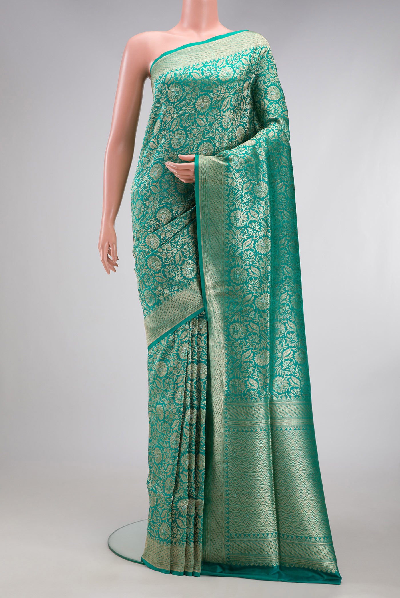 Sea Green Banarasi Silk Saree with Zari Brocade on the body and Zari Border.  displayed on a mannequin
