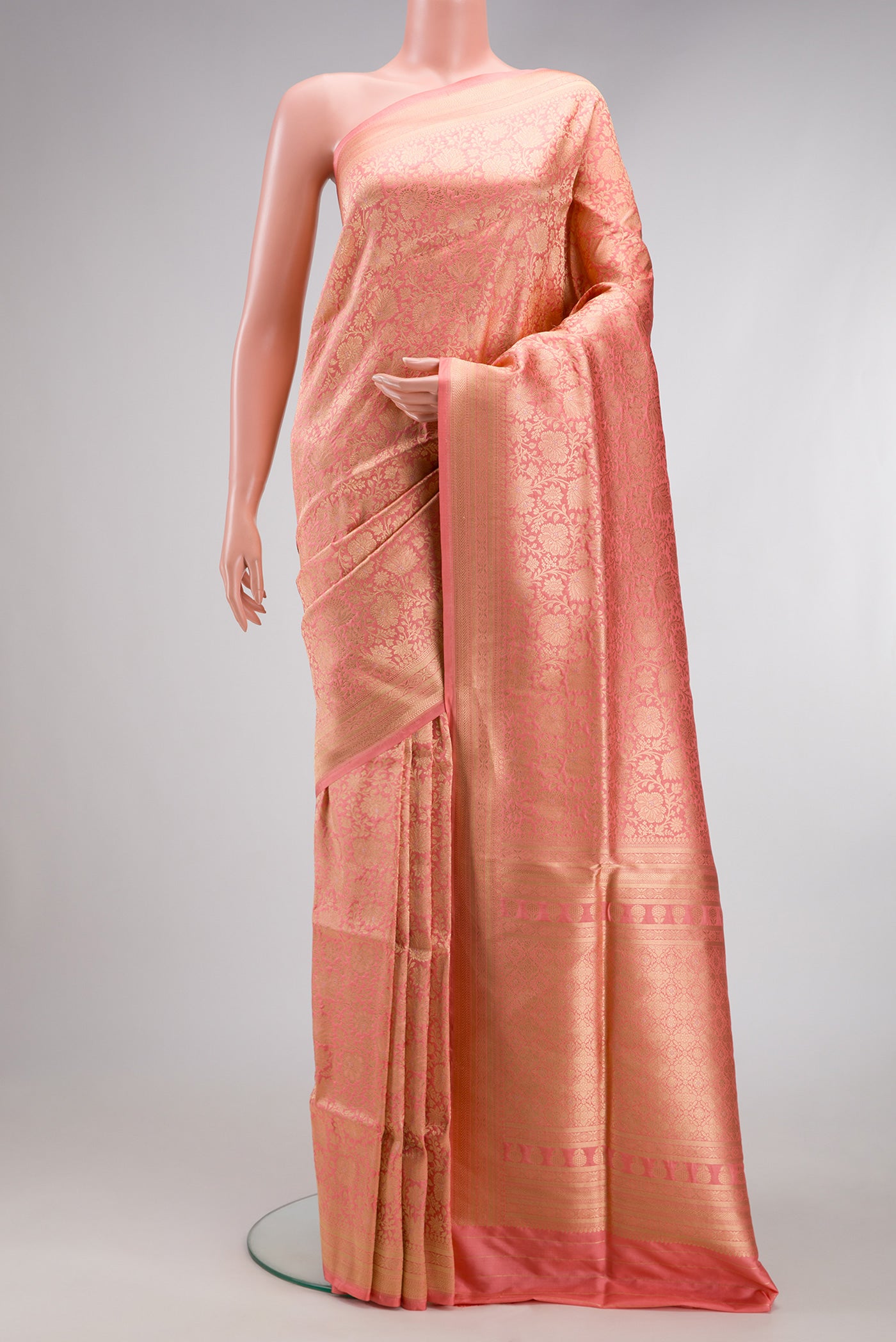 Golden Peach Banarasi Silk Saree with Zari Brocade on the body and Zari Border.  displayed on a mannequin