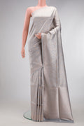 Grey Banarasi Silk Saree with Zari Brocade on the body and Zari Border.  displayed on a mannequin