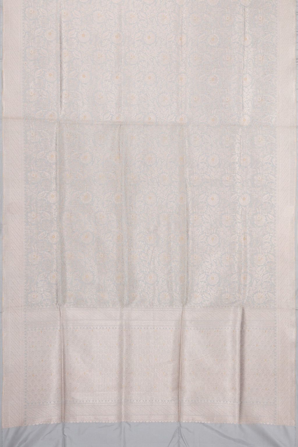 Flat view of Grey Banarasi Silk Saree with Zari Brocade on the body and Zari Border. 