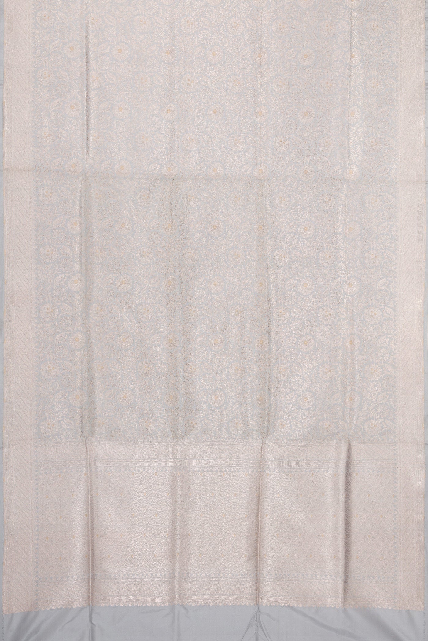 Flat view of Grey Banarasi Silk Saree with Zari Brocade on the body and Zari Border. 