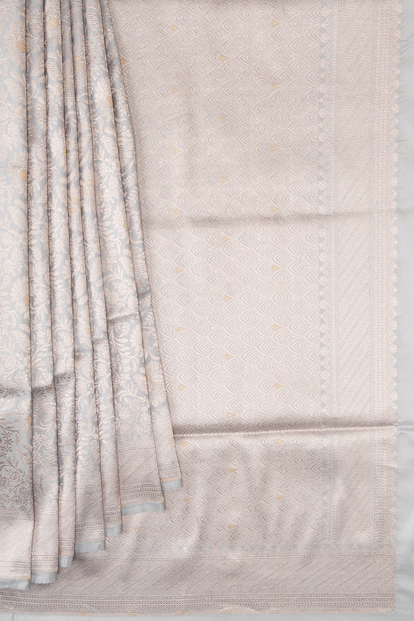 Pleats and pallu of Grey Banarasi Silk Saree with Zari Brocade on the body and Zari Border. 