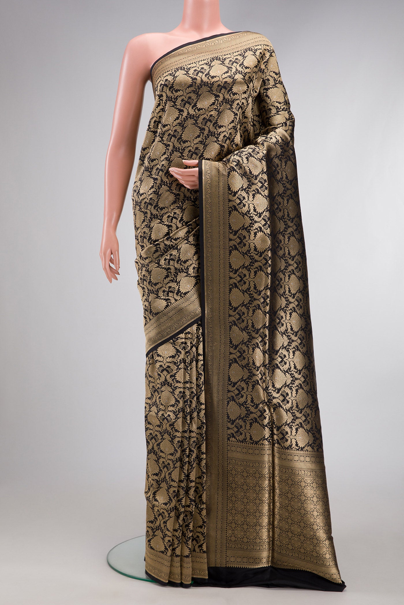 Black Banarasi Silk Saree with Zari Brocade on the body and Zari Border.  displayed on a mannequin