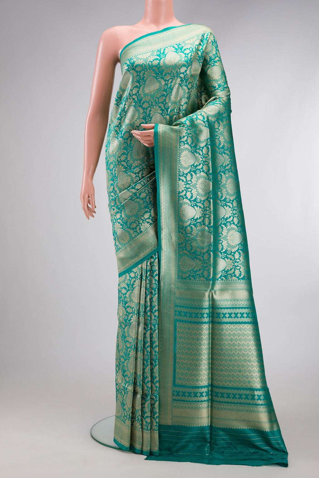 Turquoise Banarasi Silk Saree with Zari Brocade on the body and Zari Border.  displayed on a mannequin