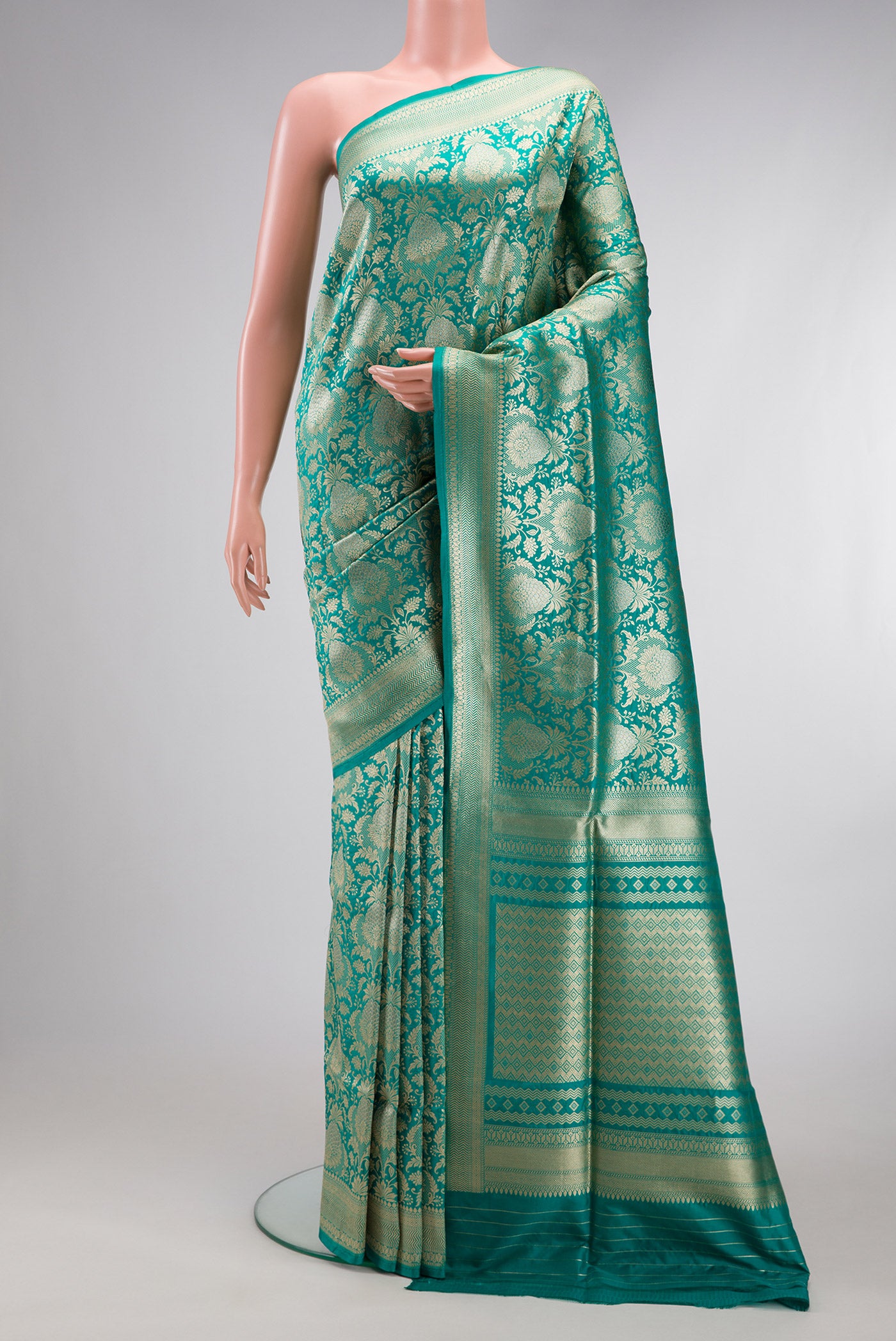 Turquoise Banarasi Silk Saree with Zari Brocade on the body and Zari Border.  displayed on a mannequin