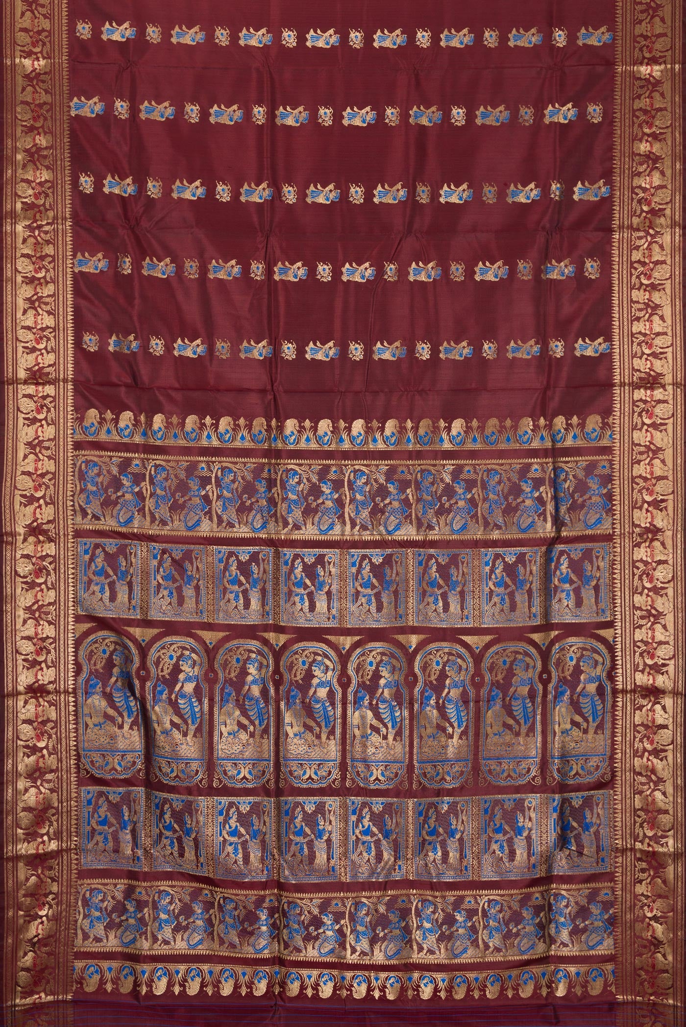 Flat view of Coffee Brown Baluchari Silk Saree with Zari And Thread Butta on the body and Zari Border. 