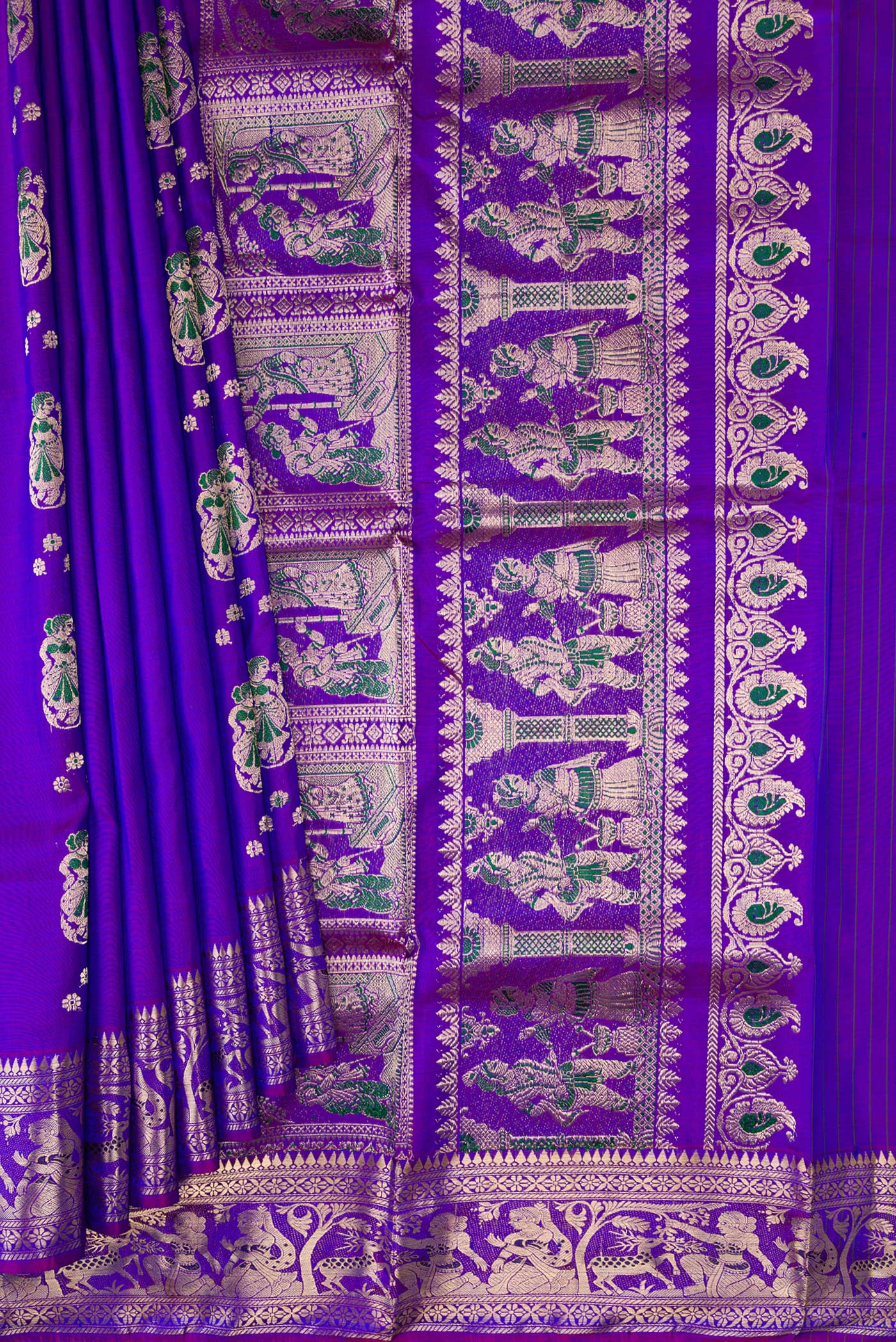 Pleats and pallu of Purple Dual Tone Baluchari Silk Saree with Zari And Thread Butta on the body and Zari Border. 