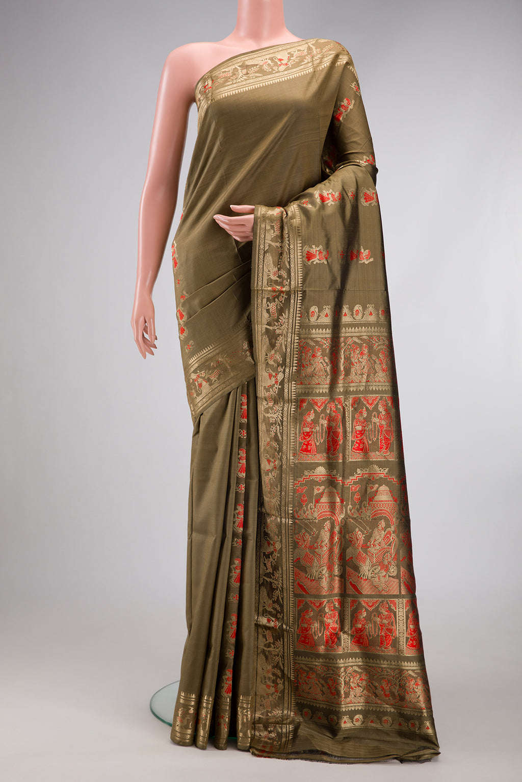 Dark Beige Baluchari Silk Saree with Zari And Thread Butta on the body and Zari Border.  displayed on a mannequin