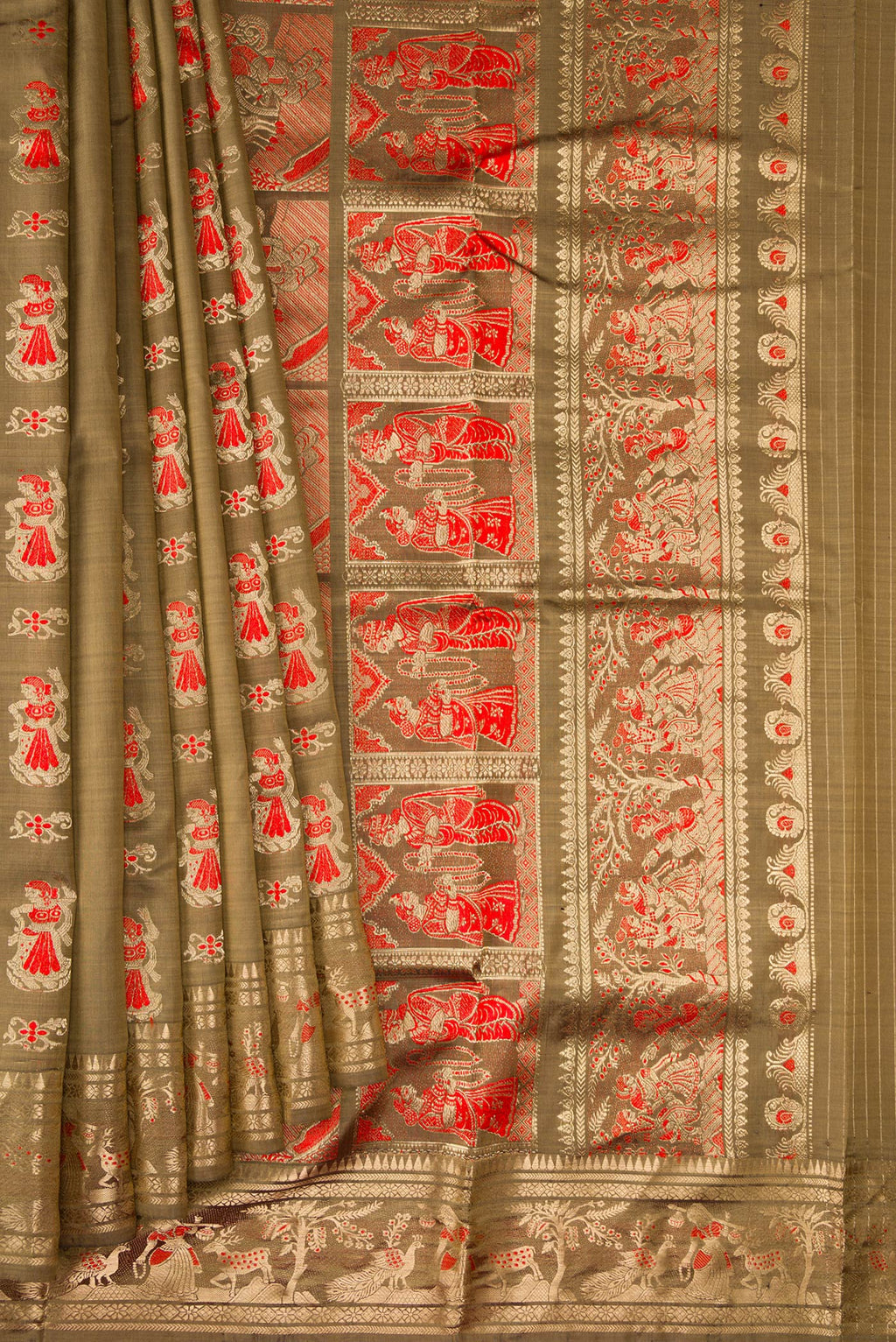 Pleats and pallu of Dark Beige Baluchari Silk Saree with Zari And Thread Butta on the body and Zari Border. 