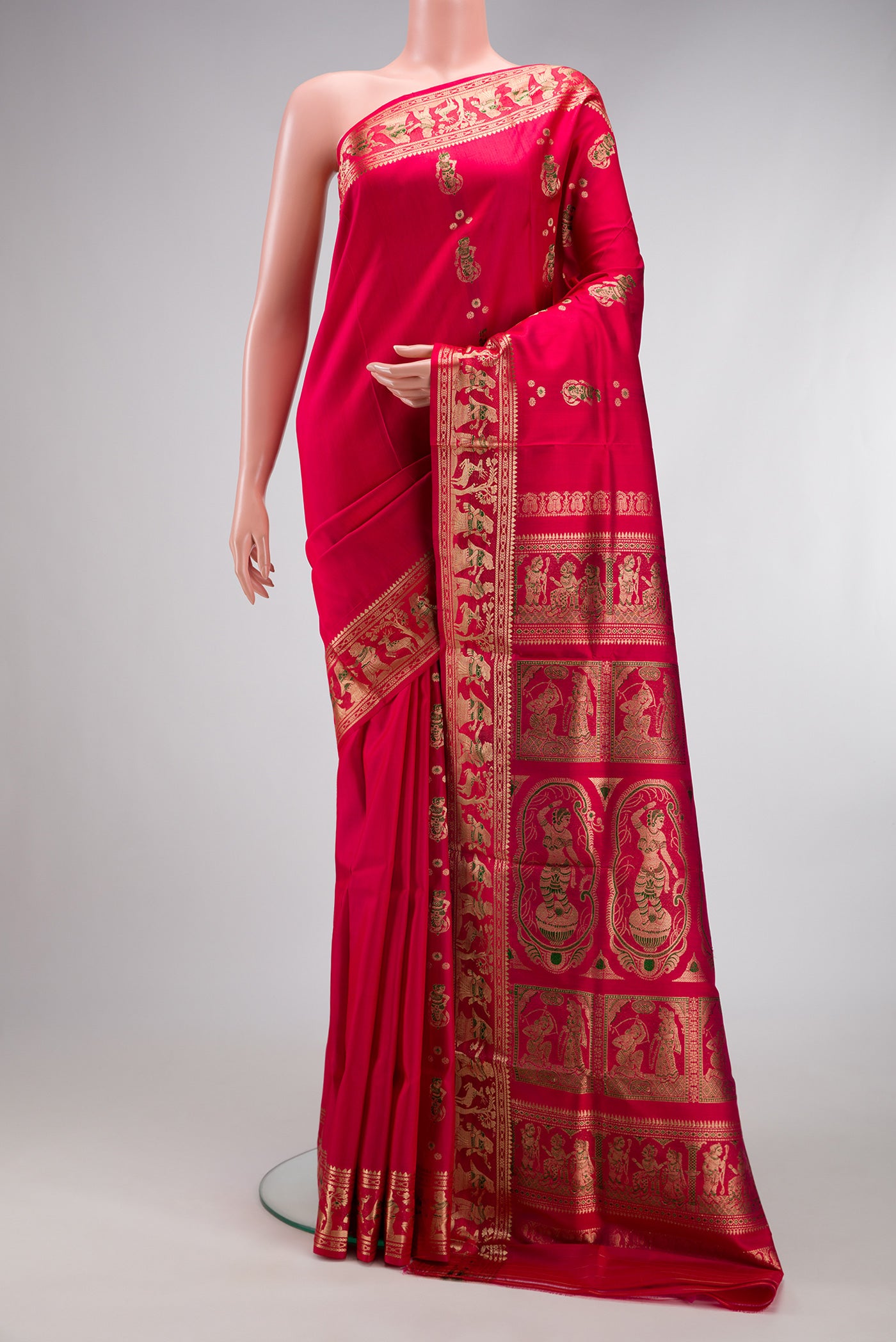 Dark Pink Baluchari Silk Saree with Zari And Thread Butta on the body and Zari And Thread Border.  displayed on a mannequin