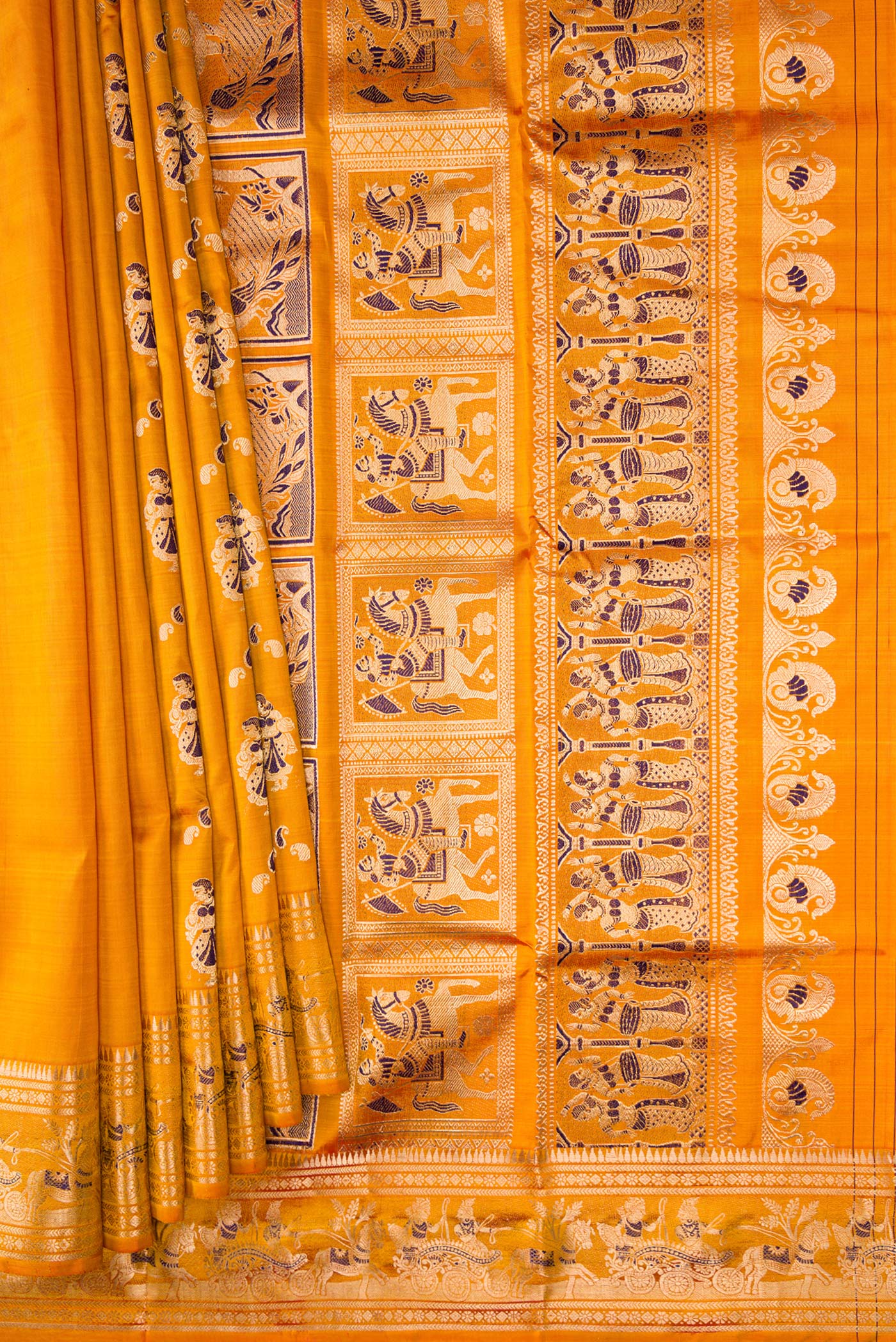 Pleats and pallu of Mustard Baluchari Silk Saree with Zari And Thread Butta on the body and Zari Border. 