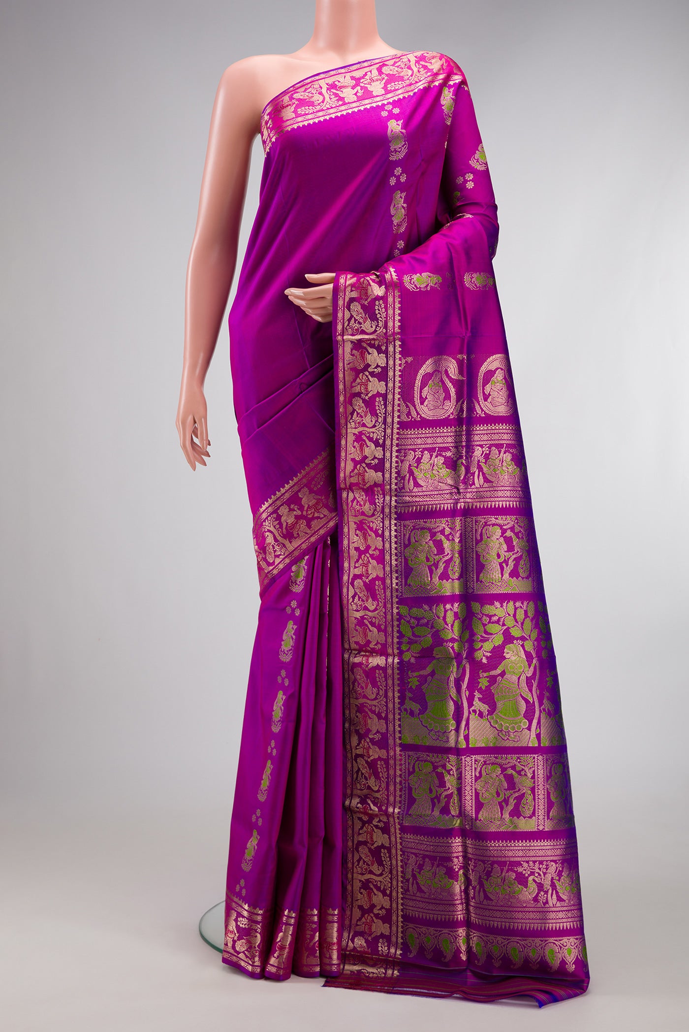 Purple Baluchari Silk Saree with Zari And Thread Butta on the body and Zari Border.  displayed on a mannequin