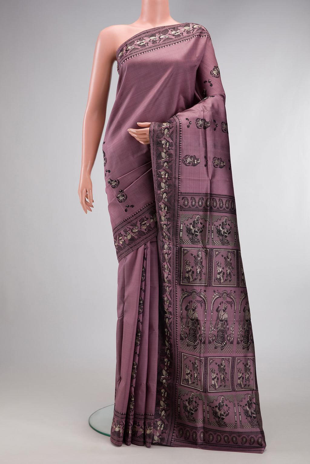 Mauve Baluchari Silk Saree with Thread Butta on the body and Thread Border.  displayed on a mannequin