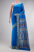 Royal Blue Baluchari Silk Saree with Thread Butta on the body and Thread Border.  displayed on a mannequin