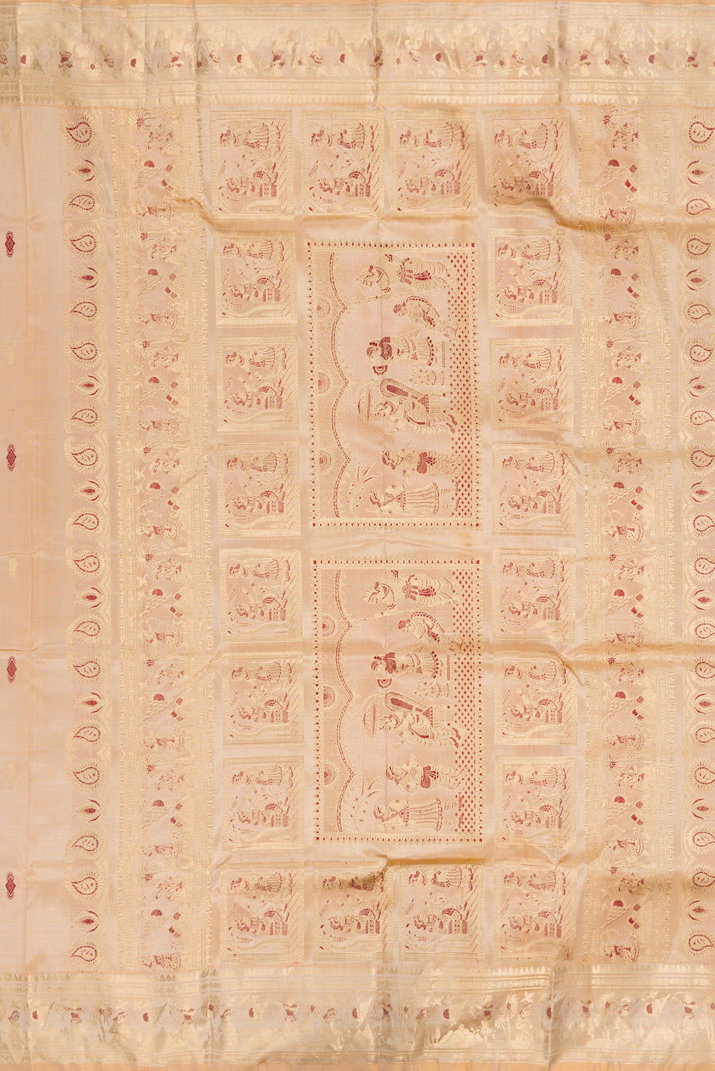 Close up image of the pallu of Beige Baluchari Silk Saree with Zari And Thread Butta on the body and Zari And Thread Border. 