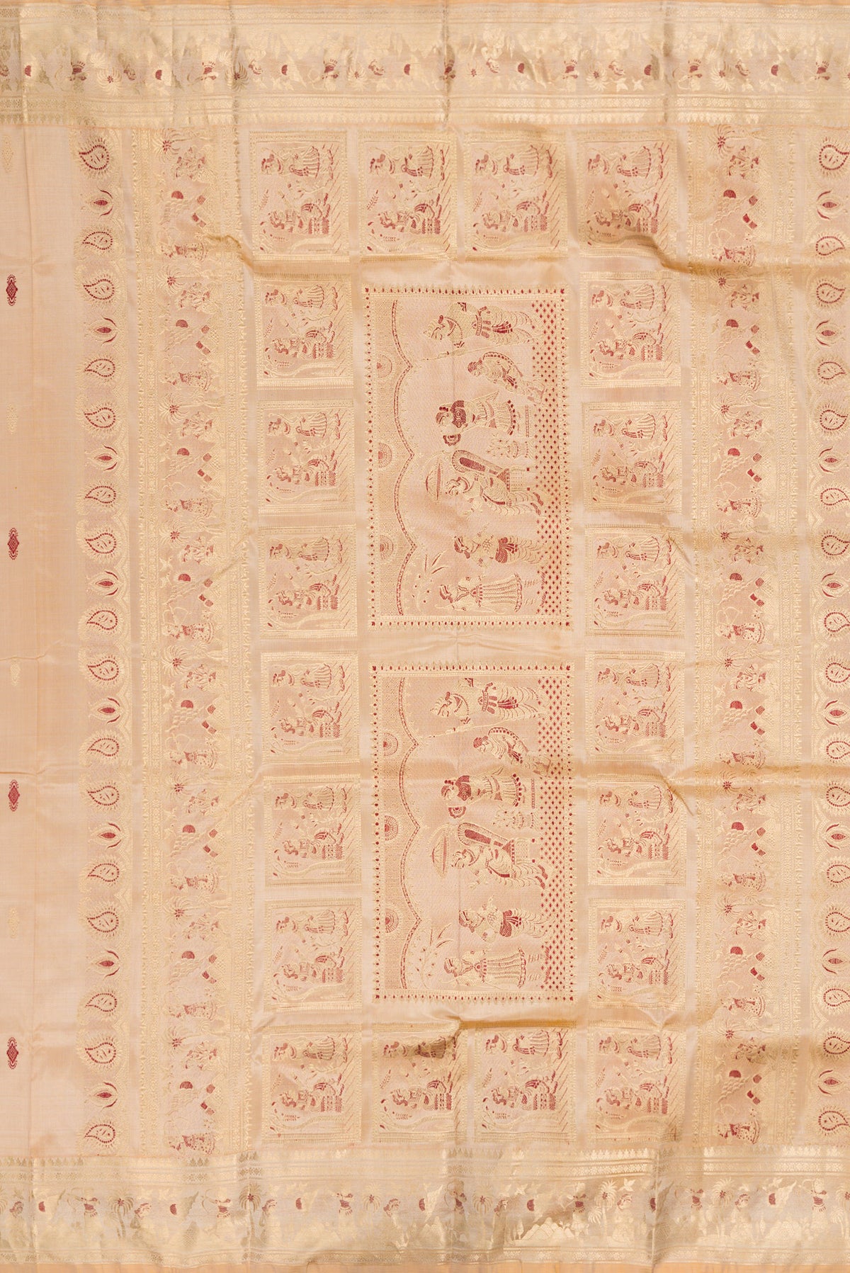 Close up image of the pallu of Beige Baluchari Silk Saree with Zari And Thread Butta on the body and Zari And Thread Border. 