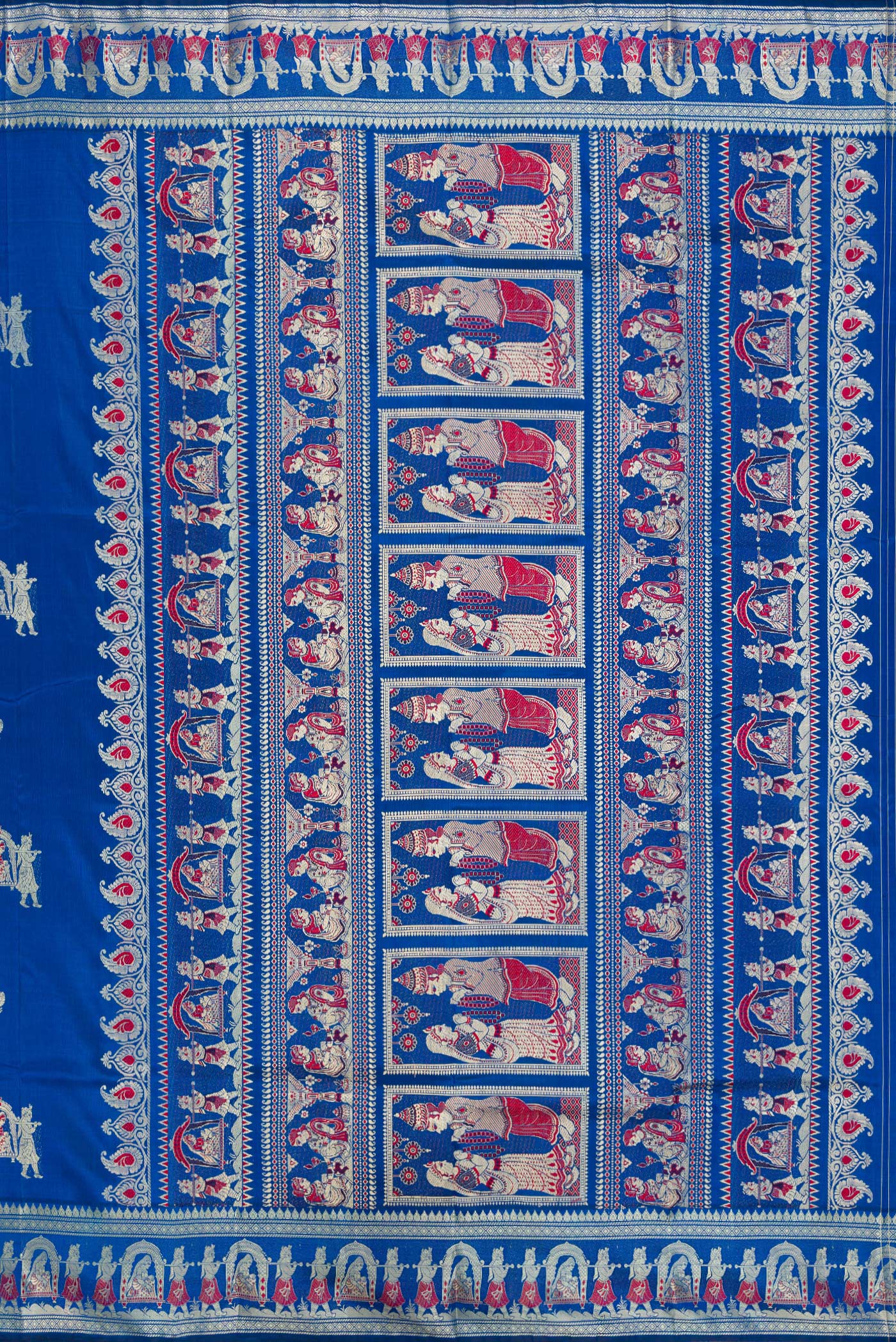 Close up image of the pallu of Royal Blue Baluchari Silk Saree with Thread Butta on the body and Thread Border. 