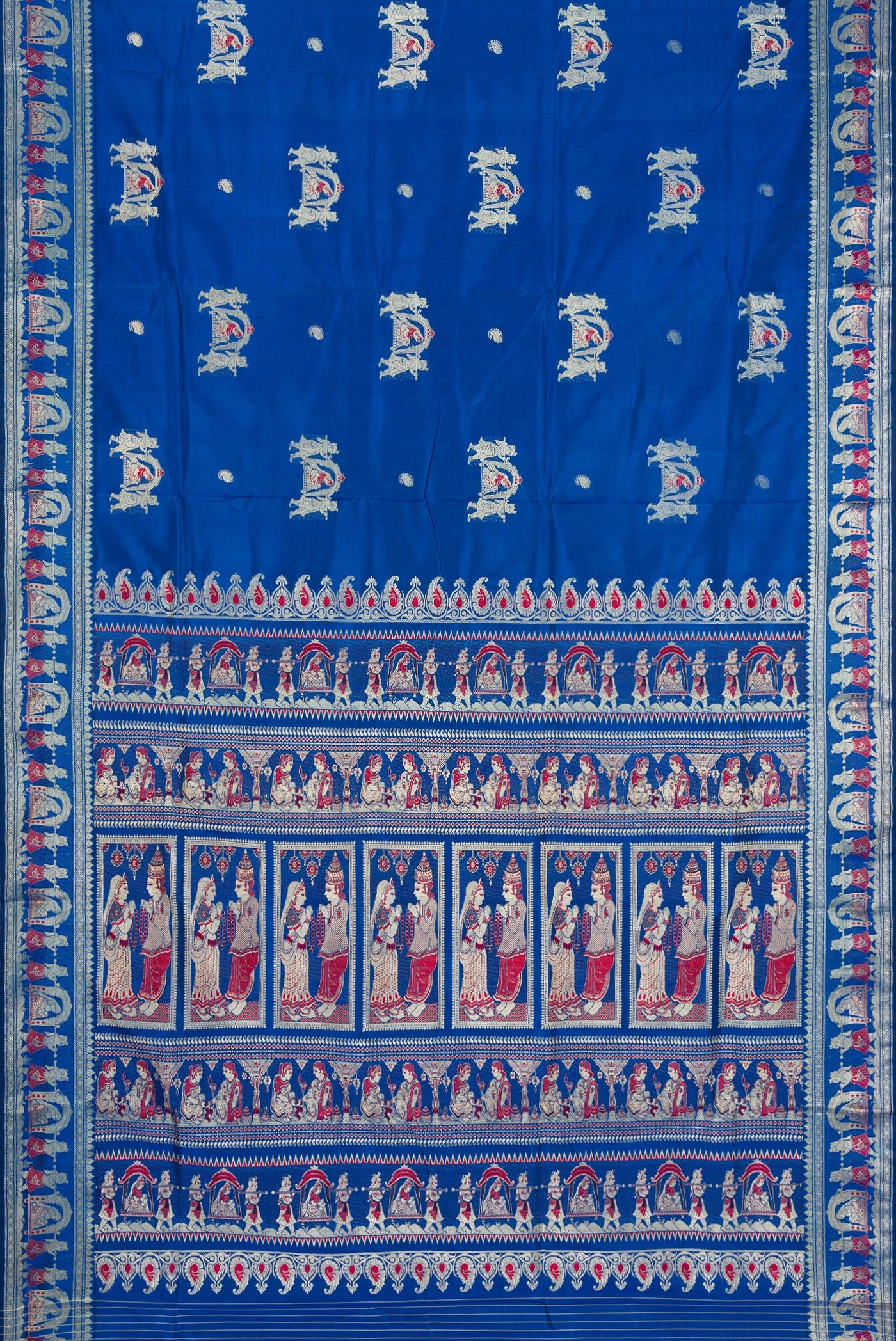 Flat view of Royal Blue Baluchari Silk Saree with Thread Butta on the body and Thread Border. 