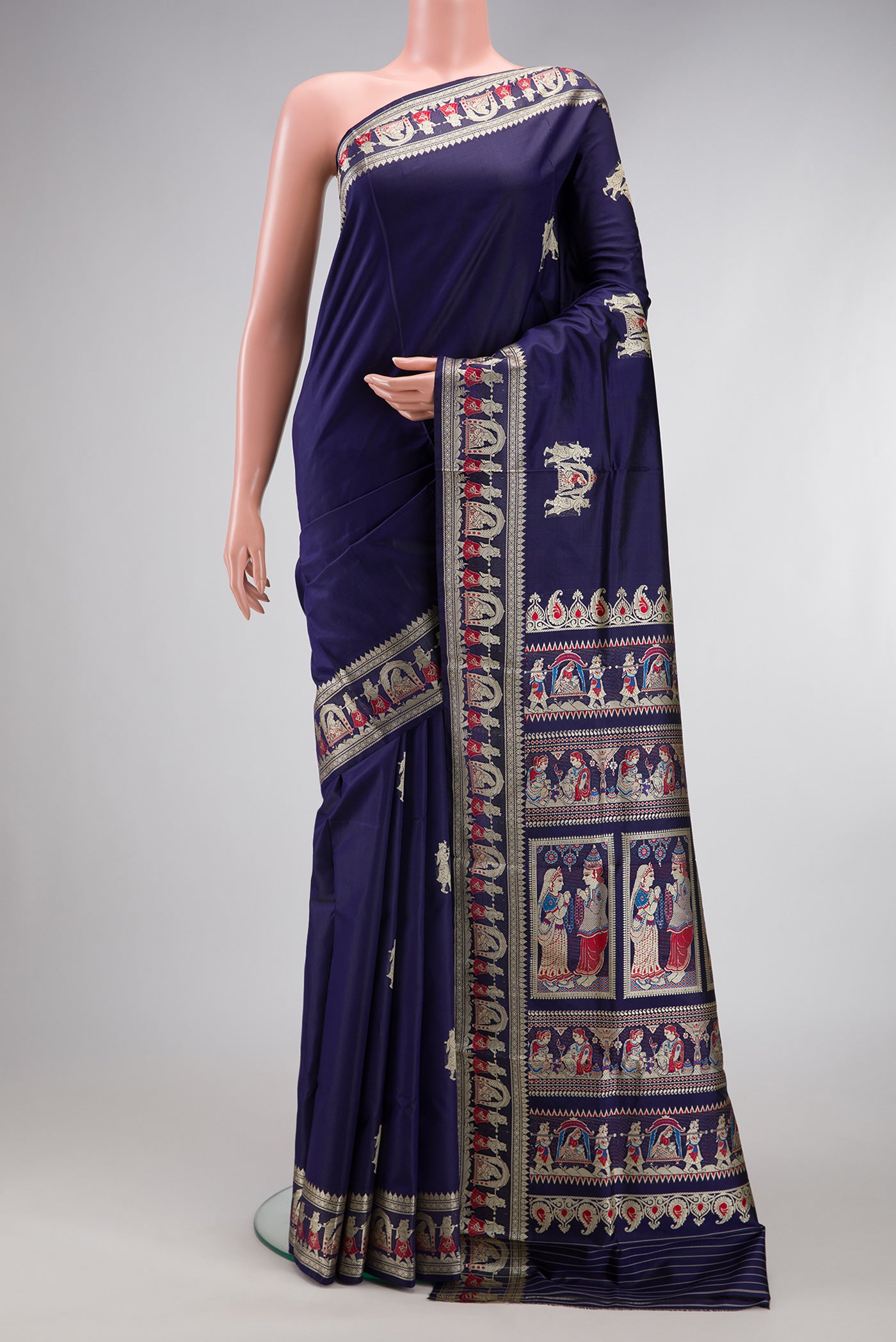 Navy Blue Baluchari Silk Saree with Thread Butta on the body and Fancy Border.  displayed on a mannequin