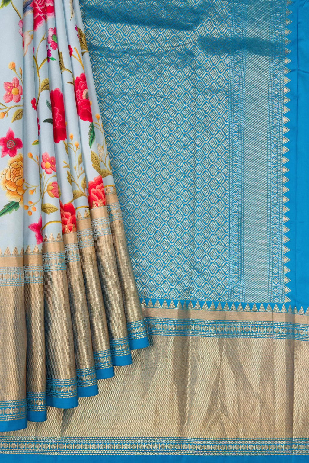 Pleats and pallu of Light Blue Kanjivaram Silk Saree with Floral Print on the body and Zari Border. 