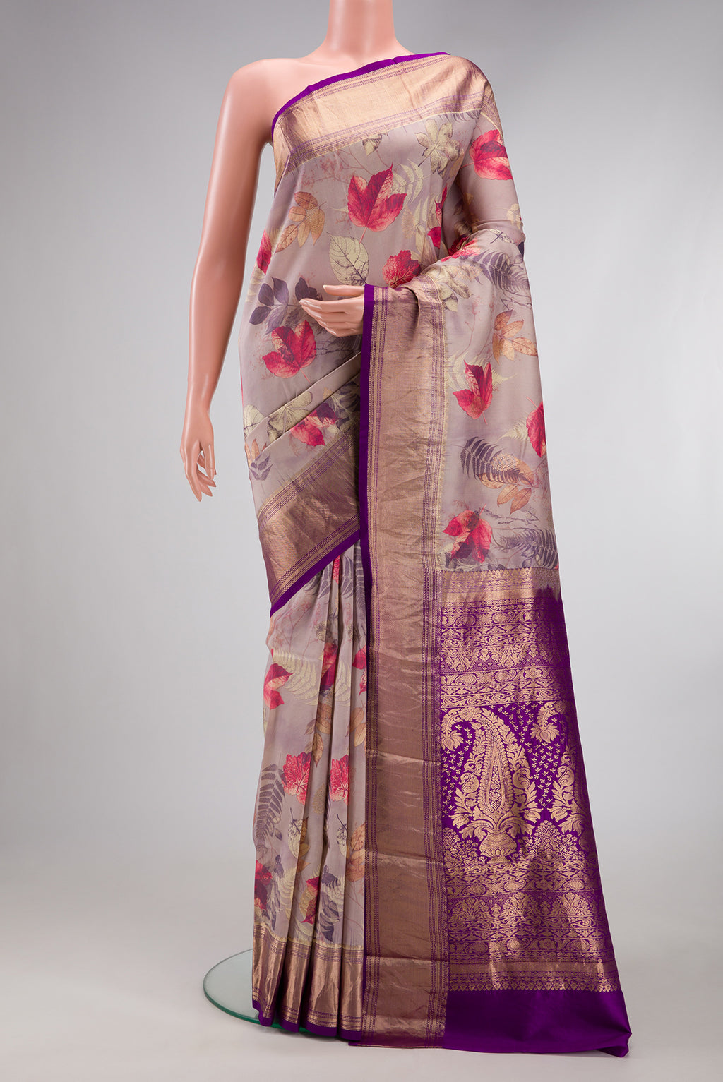 Rose Gold Kanjivaram Silk Saree with Floral Print on the body and Zari Border.  displayed on a mannequin